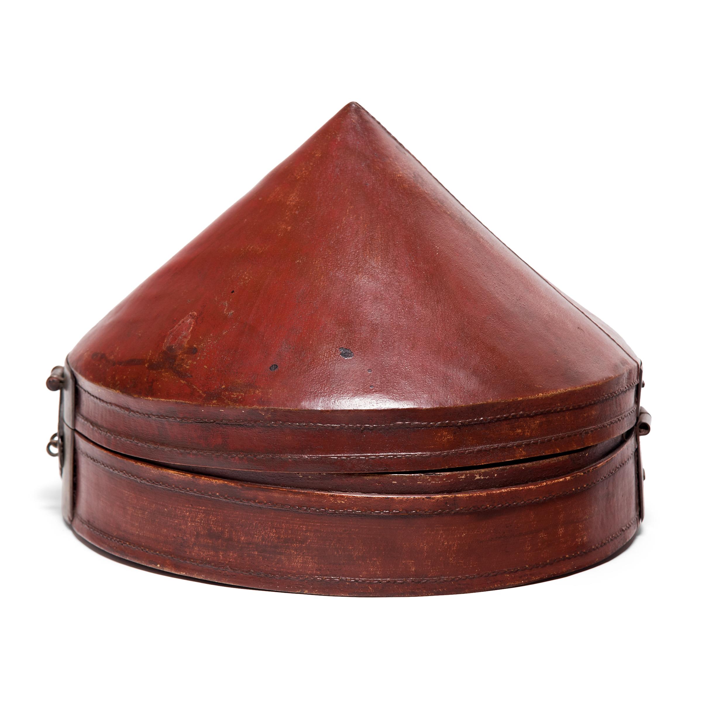 No self-respecting man in Qing-dynasty China would leave the house without some kind of hat. In fact, headgear was so central to social status that even the containers used to store one's hat were beautifully constructed.

This pointed hat box