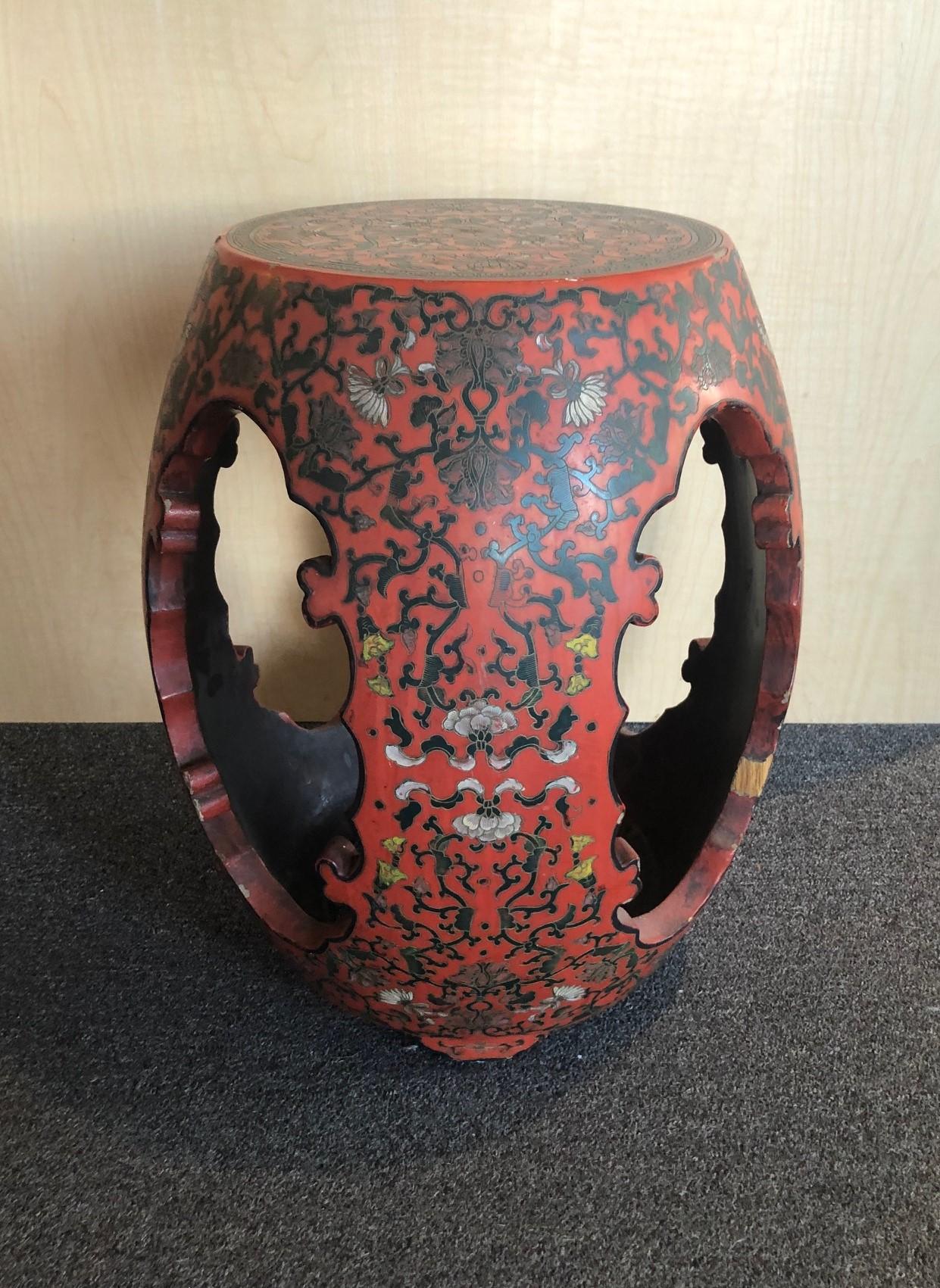 A very nice Chinese red lacquered barrel form garden stool / plant stand, circa 1940s. I believe the stool is made of elm wood and covered with a rich red lacquer finish and intricate floral design. The stool measures 18