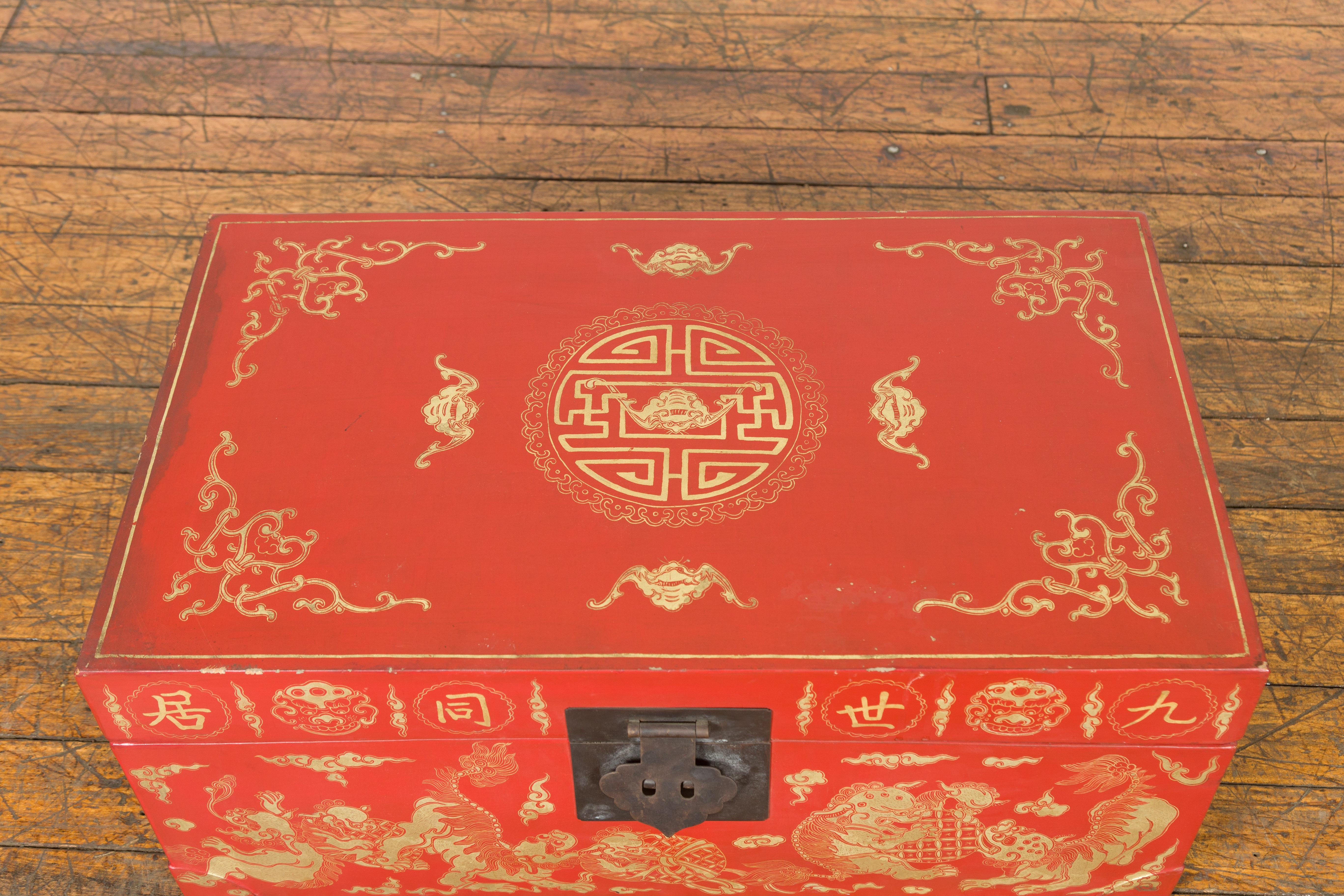20th Century Chinese Red Lacquered Blanket Chest with Gilt Motifs and Guardian Lions For Sale