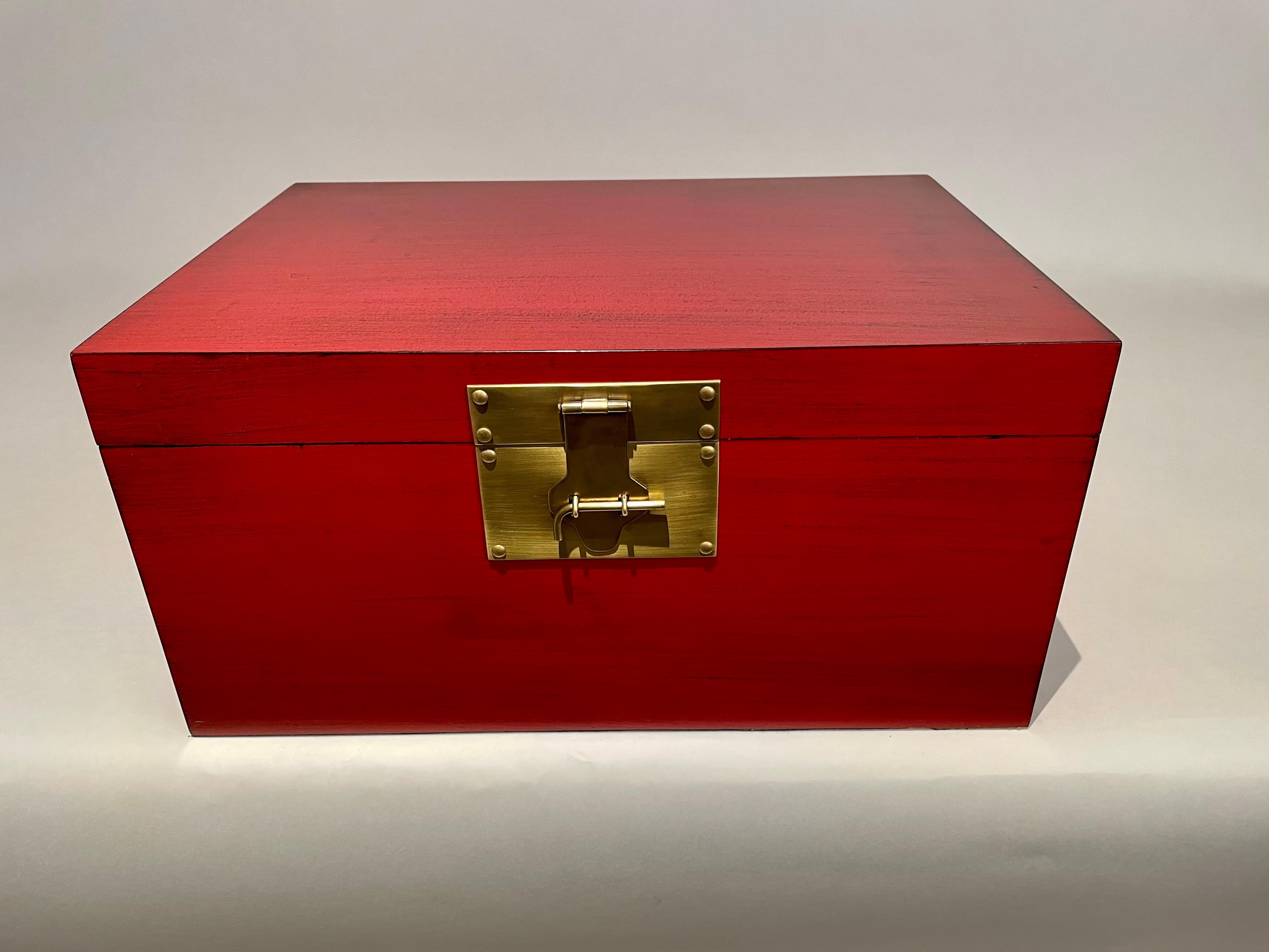 Chinese red and black lacquered box with fine brass mounts in the Chinese Export style. Lovely color. A refined and classic decorative box, beautiful craftsmanship. 
20 wide 14 deep 10 high
We also have a smaller companion box, they look great
