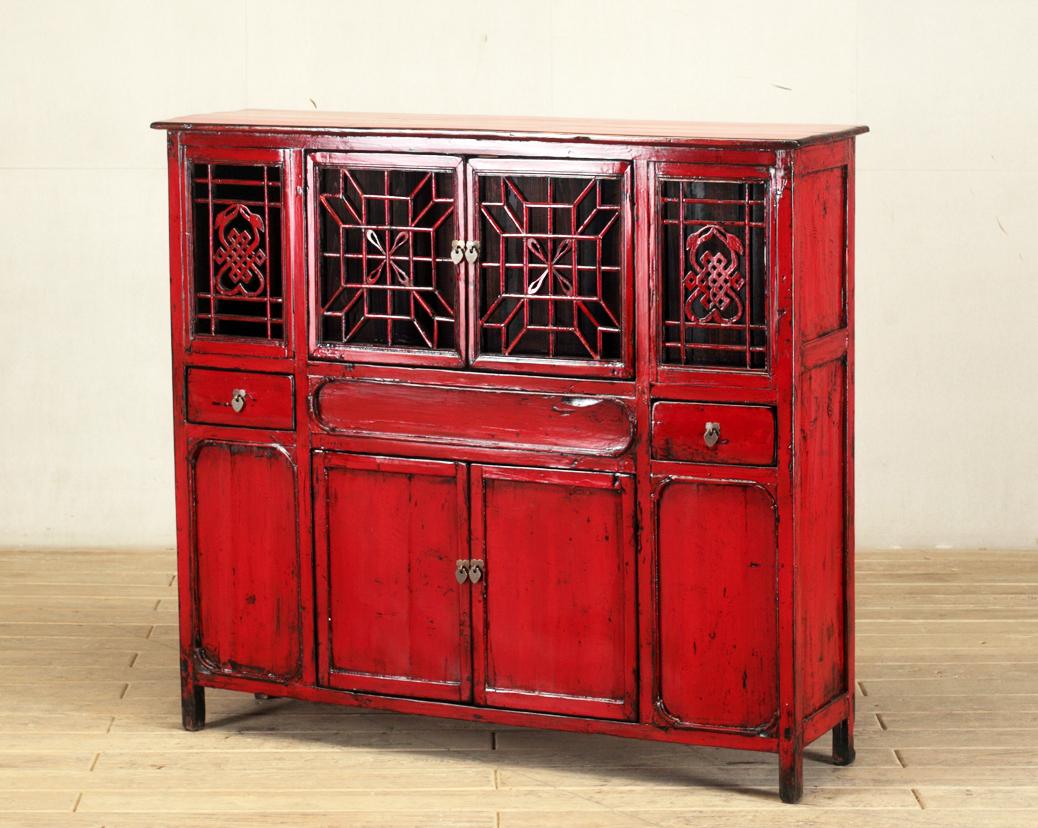 This cabinet was made from reclaimed pine wood with traditional nail-less joinery. The red-lacquered color on the piece has been enhanced with a sophisticated French polish finish. The piece was restored in a workshop using reclaimed wood in China