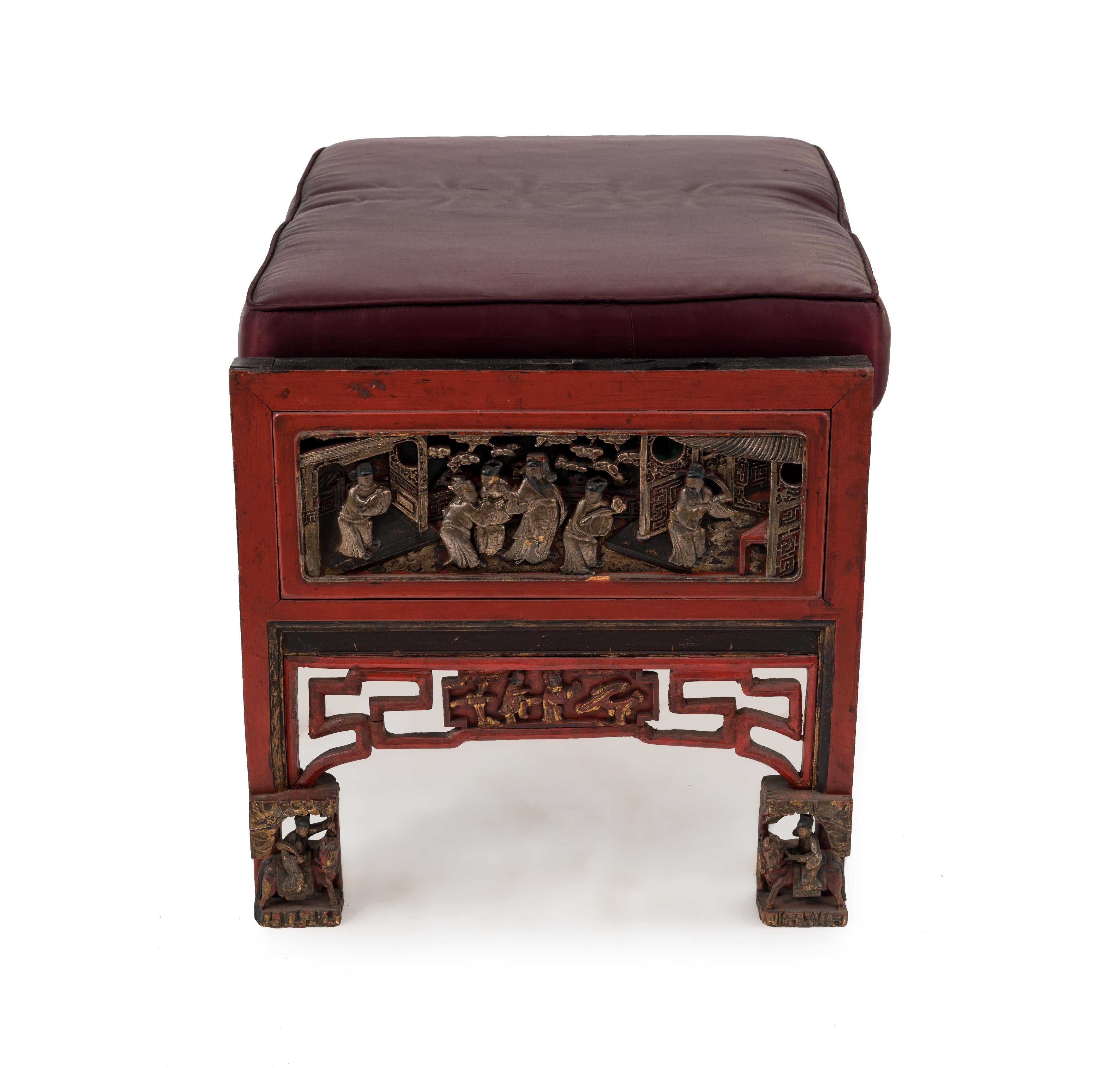 Asian Chinese (19th century) red lacquered chinoiserie carved bench with black seat cushion.