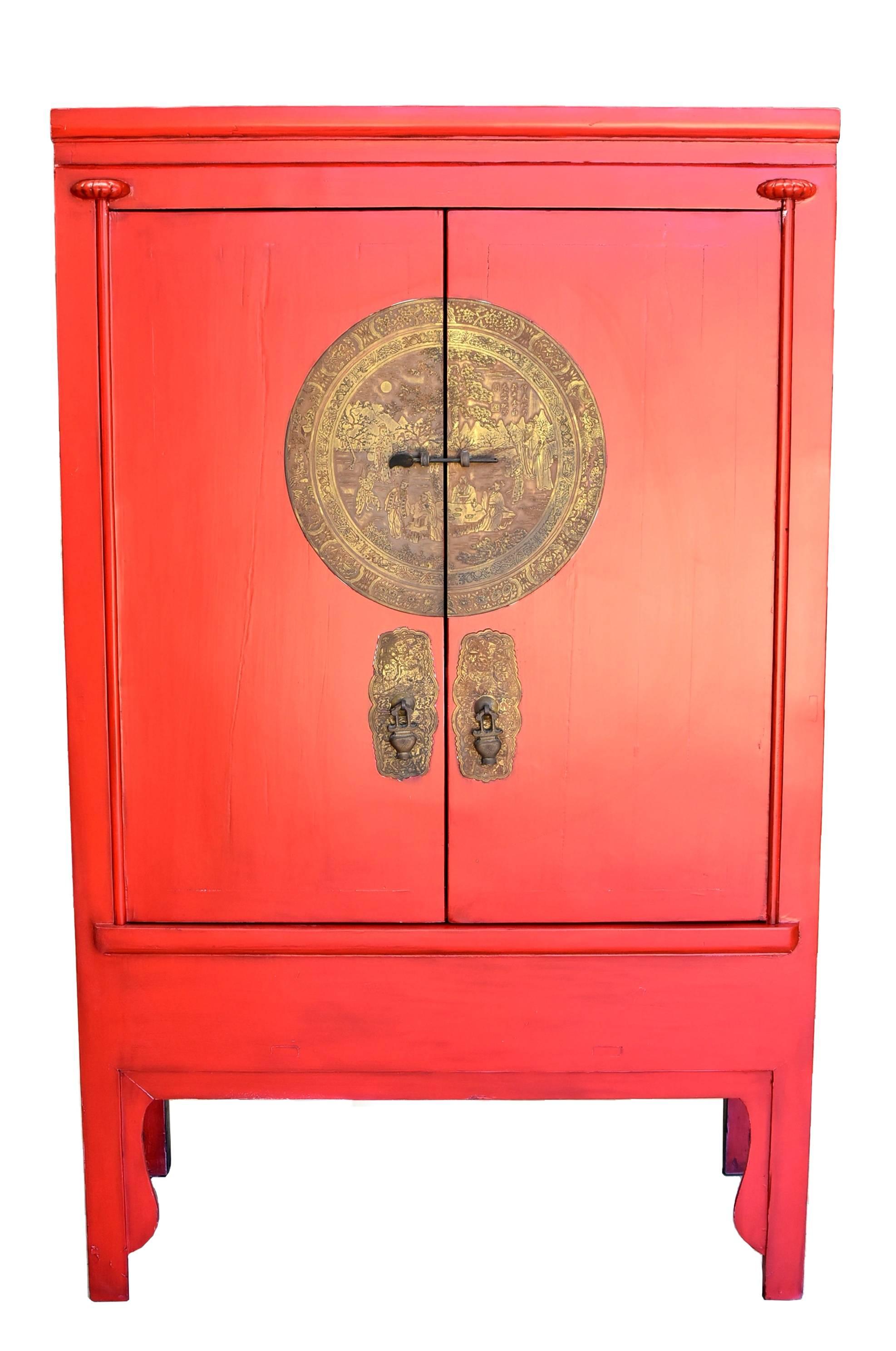A traditional wedding cabinet from southern China. Bright red symbolizes good fortune, Golden brass medallion symbolizes perfection. Removable shelves provide flexible storage. Black and red contrast add visual drama. A Chinese classic, this piece