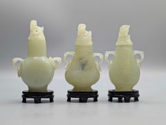 Chinese Republic Period Carved Pale Green Hardstone Vases with Foo Lion Finials