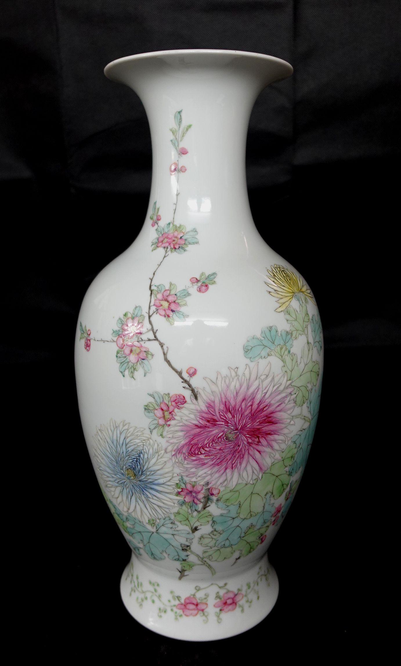 Chinese Republic period large famille rose porcelain vase. Fine famille rose flower and branch decoration. Red seal mark on the base. Drilled for the lamp. Measure: 16in high.
 