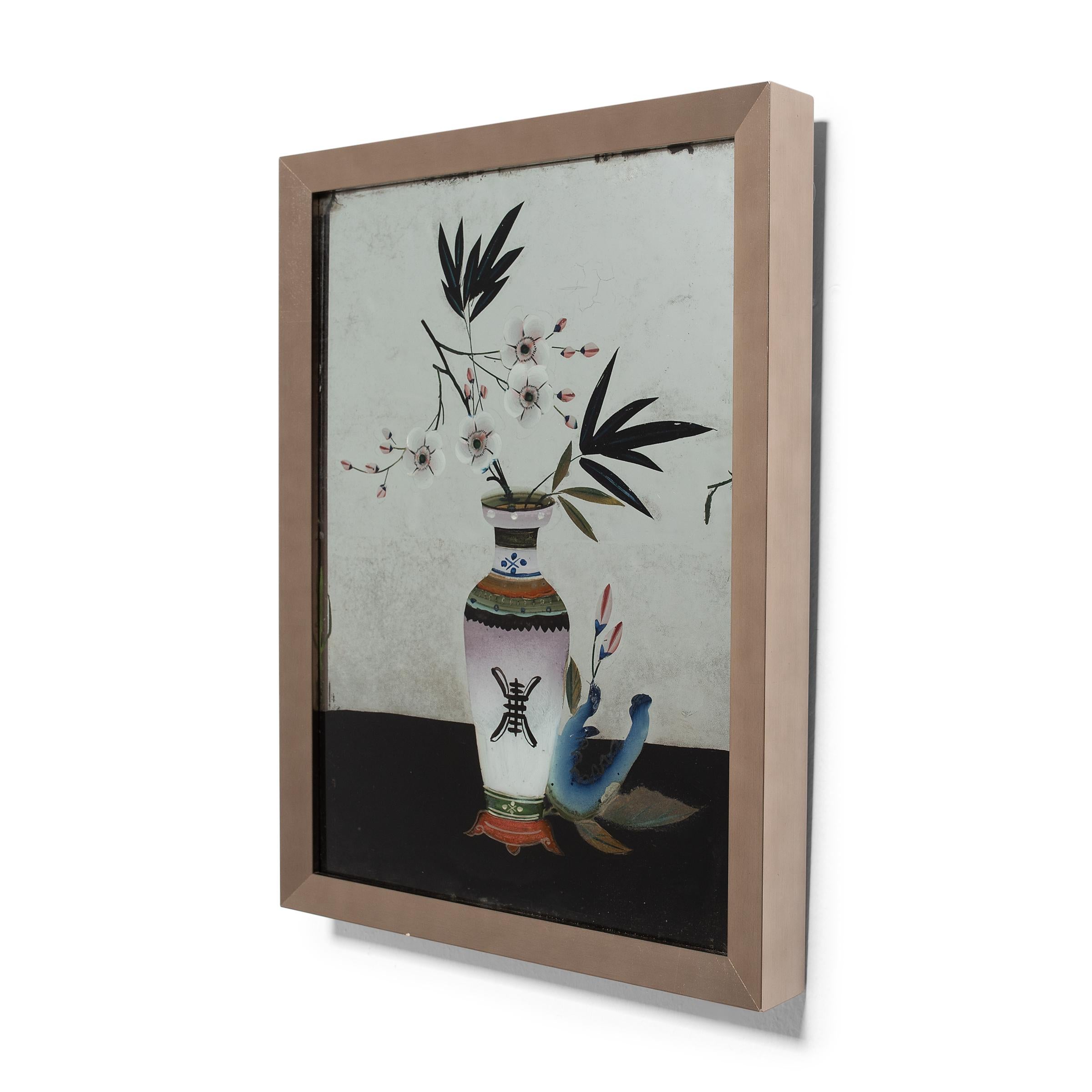 This colorful floral still life is a charming example of Chinese reverse glass painting. Popularized during the Qing dynasty, reverse glass painting requires an artist to essentially work backwards, starting with details and shading before adding