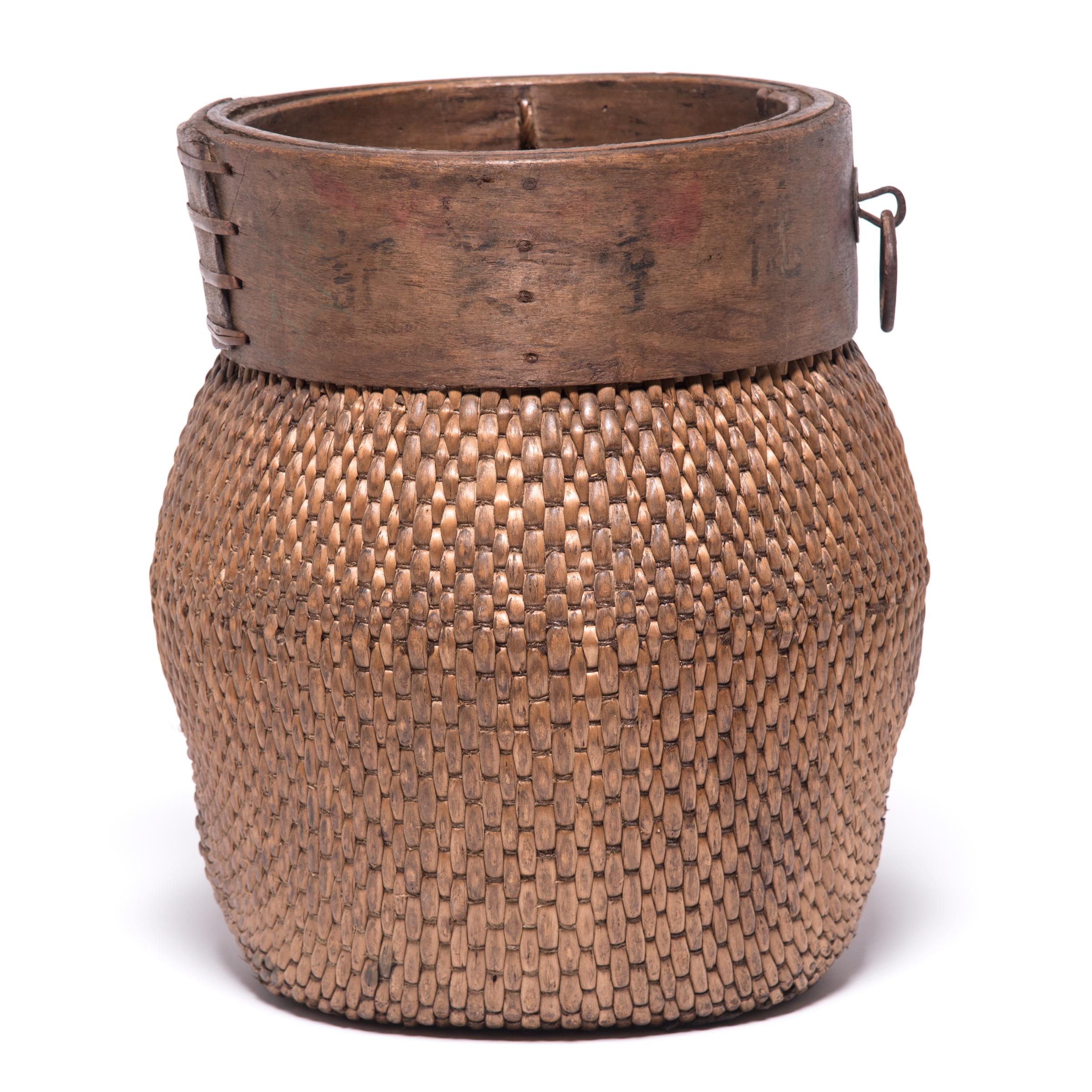 Centuries ago, a reed fisherman’s basket like this one would have been fairly common in rural China: an everyday item that would have been used until it was worn through. This particular example remains in beautiful condition and so a century later,