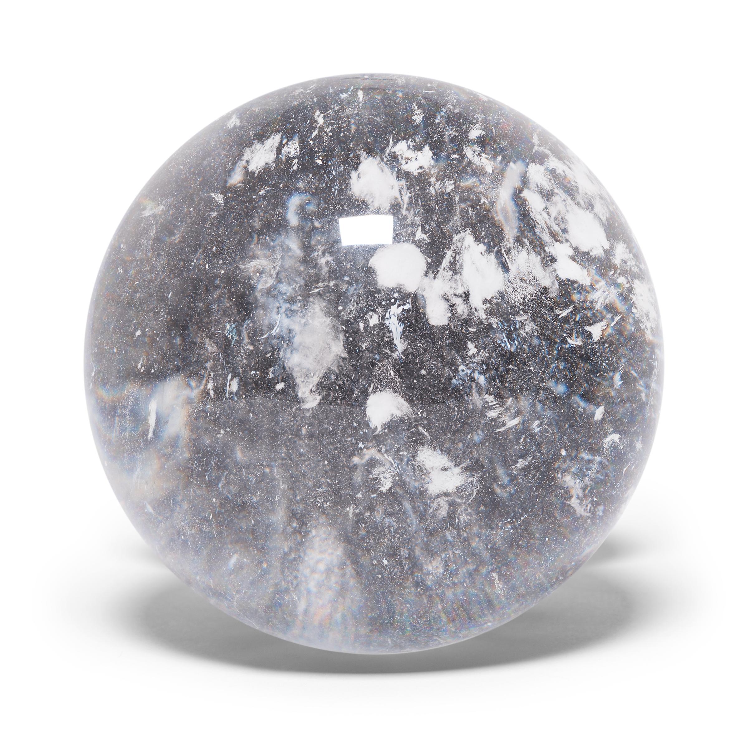 Gem lore is endless, and every culture has its own beliefs about specific stones tied to cultural history, geography, and spiritual practices. In China, some practitioners of feng shui value clear quartz, like this beautiful crystal ball, for its