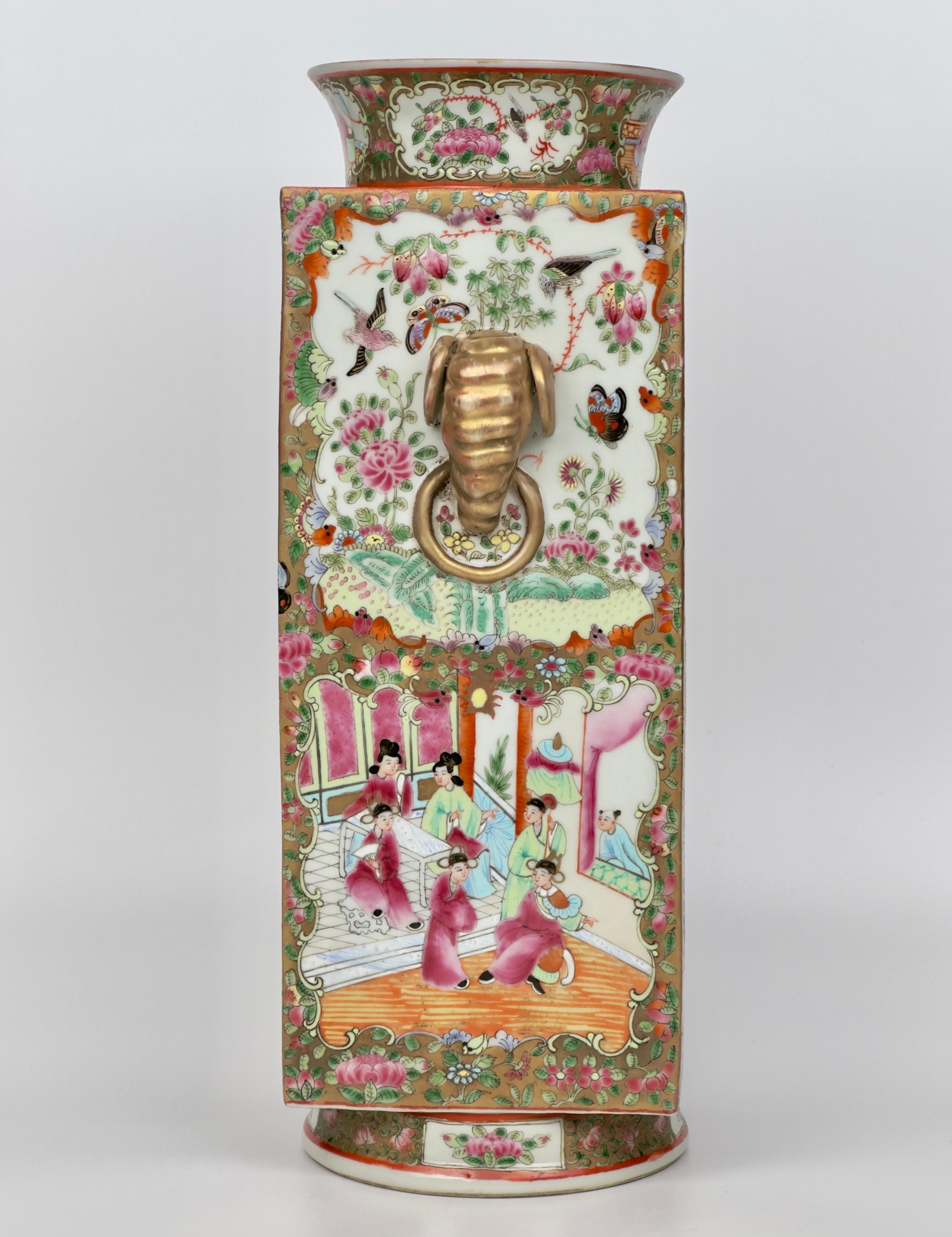 The square body famille rose porcelain vase with a Rose Medallion pattern, gilt highlights, and polychrome enamel decoration with alternating medallions of court life against a ground of peonies, fruits, and insects with opposed elephant mask