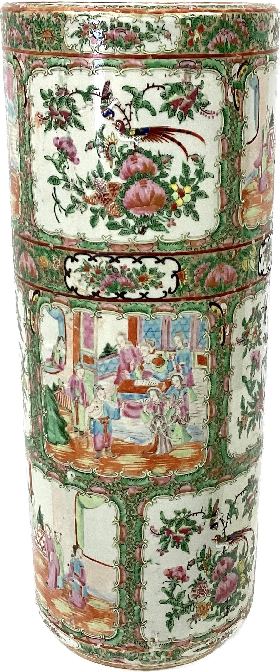 Antique 19th Century Chinese rose medallion umbrella stand. Vibrant floral and figures in colors of pink, red, green, etc. on a white background. 