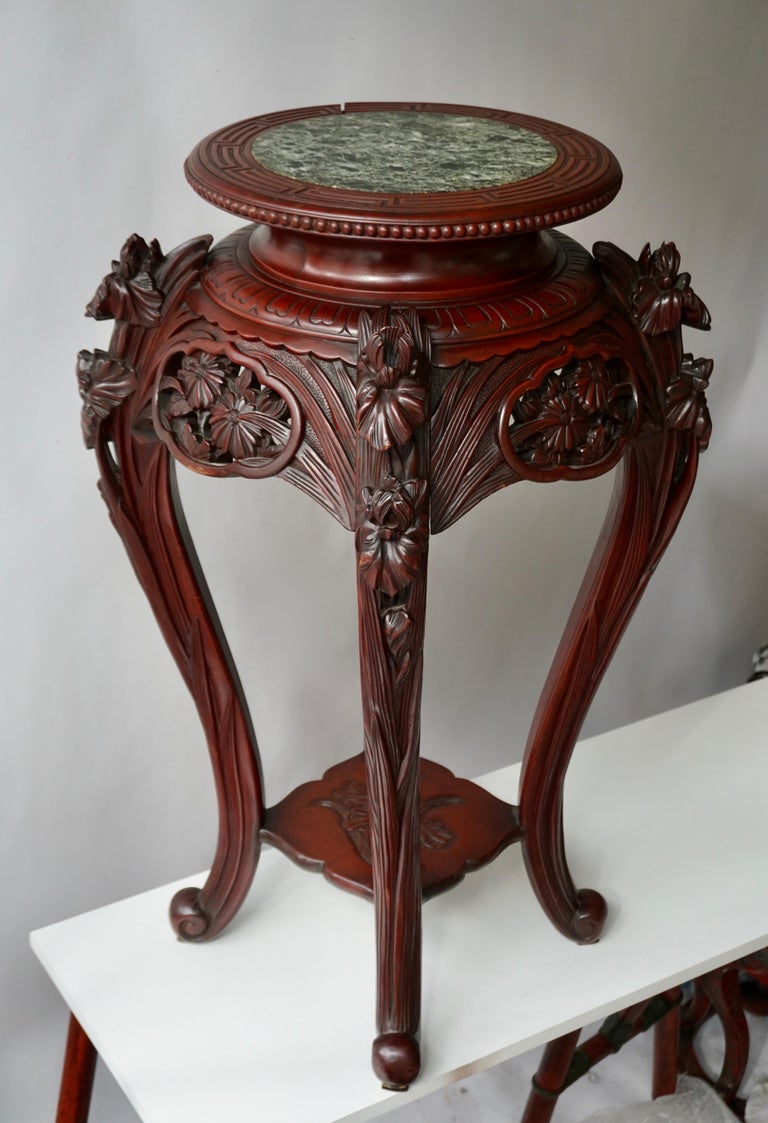 These striking Chinese rosewood pedestal with marble top stand well above 85 cm (33.46 inch) tall, making a truly grand statement. The rich rosewood is lavishly carved with dramatic scrollwork. Very good condition,

circa 1850.

Measures: 33.46