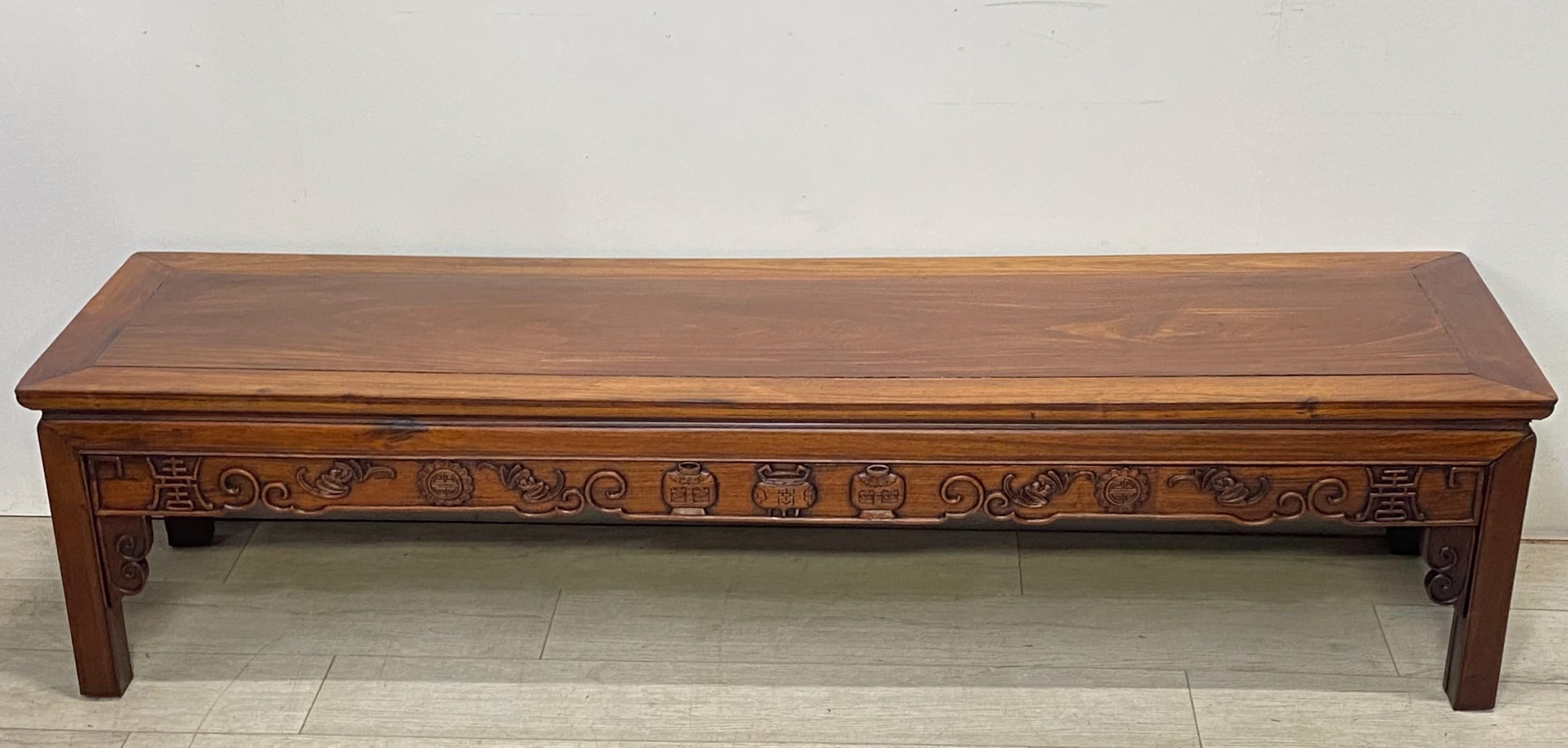 Chinese rosewood altar table table cut down to a low table or bench in height.
Marked made in Hong Kong but we believe the age to be late 19th century to early 20th century.
Purchased from a fine estate in San Francisco, this was used at the foot