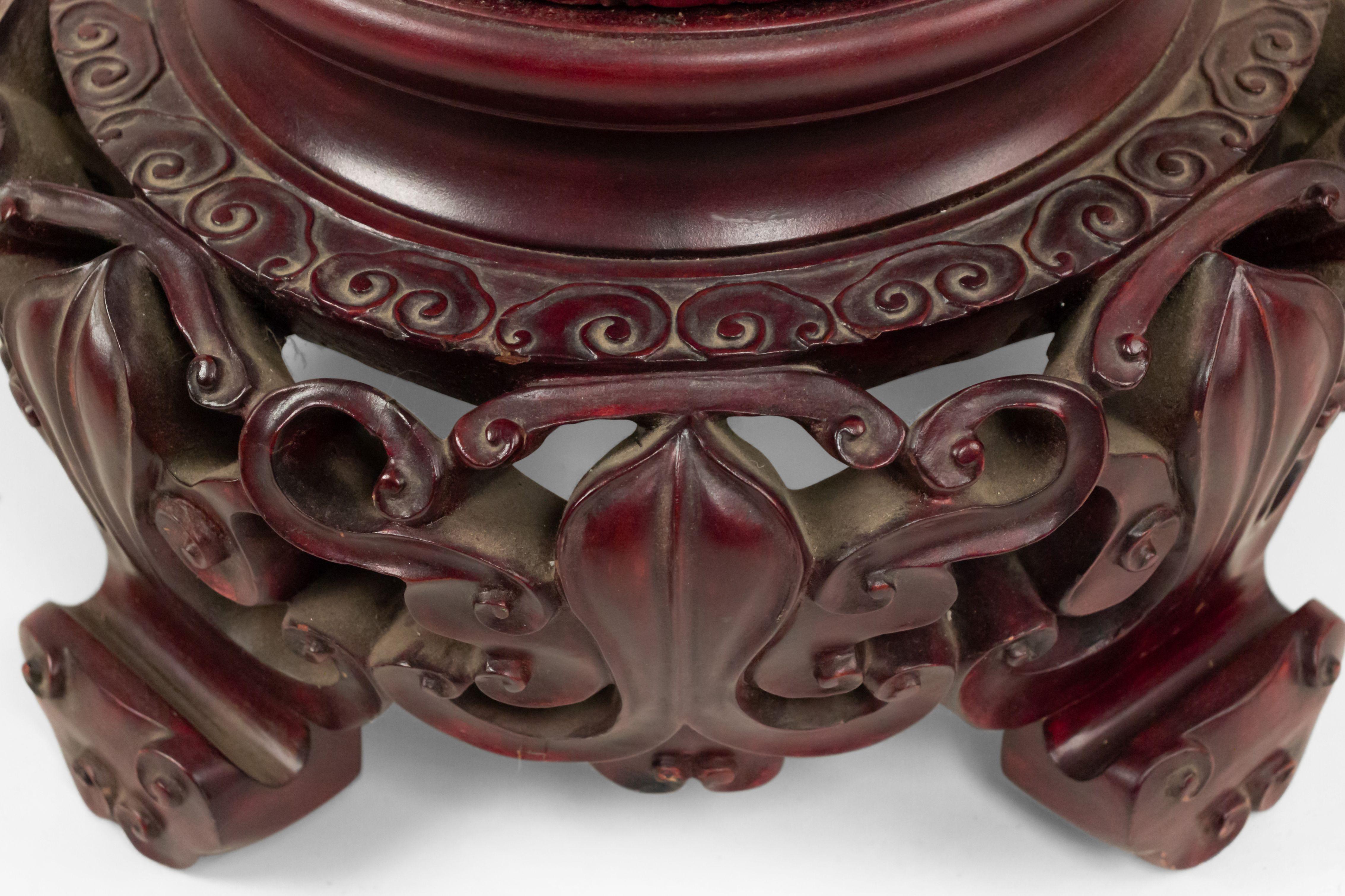 Asian Chinese-style rosewood jardiniere stand with a fluted lotus design over a carved filigree round base with 4 feet.
       