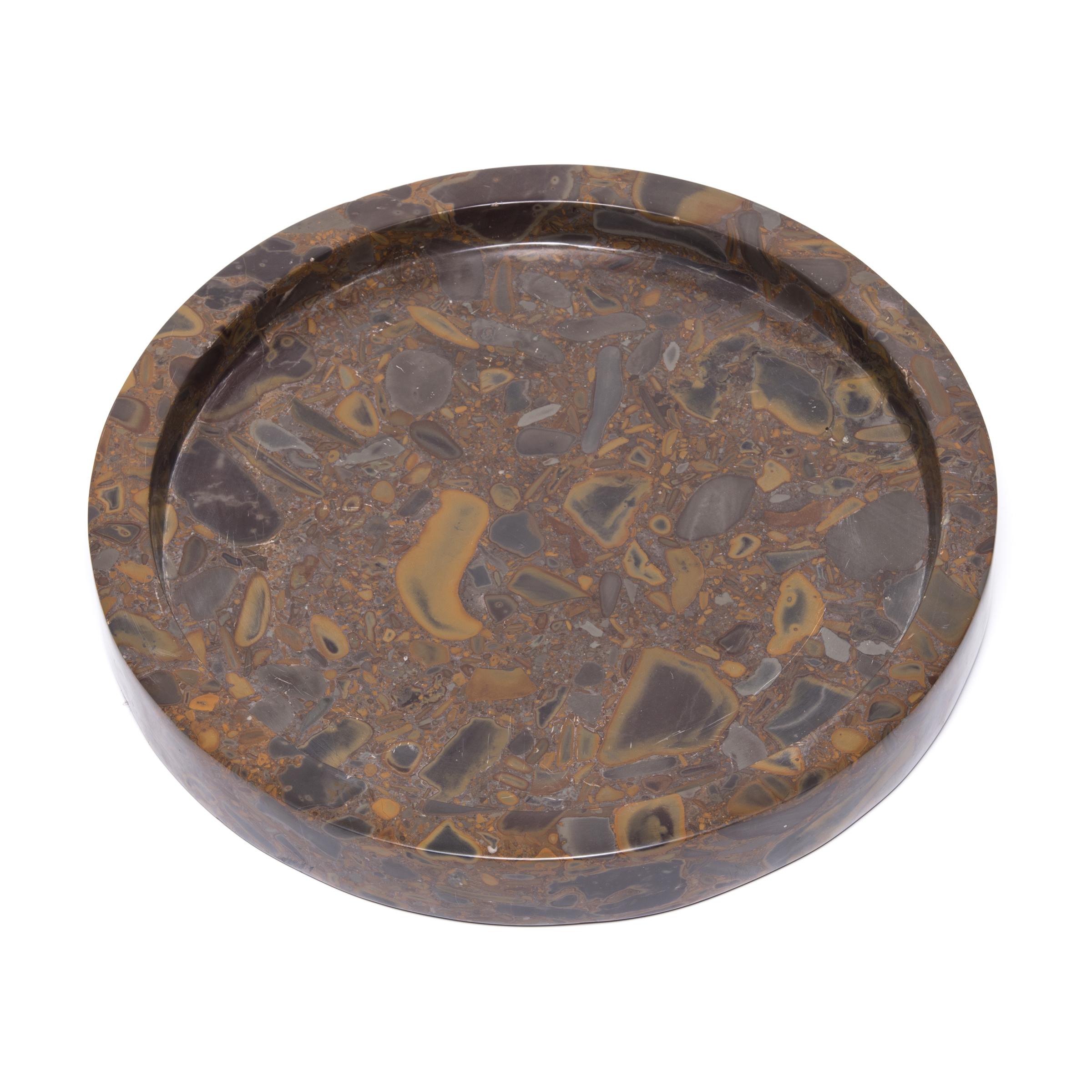 Named for its unique composite nature, puddingstone is a conglomerate stone indigenous to southern China. Prized by scholars for generations, the abstract patterns were an invitation for contemplation. This contemporary tray is hand carved into a