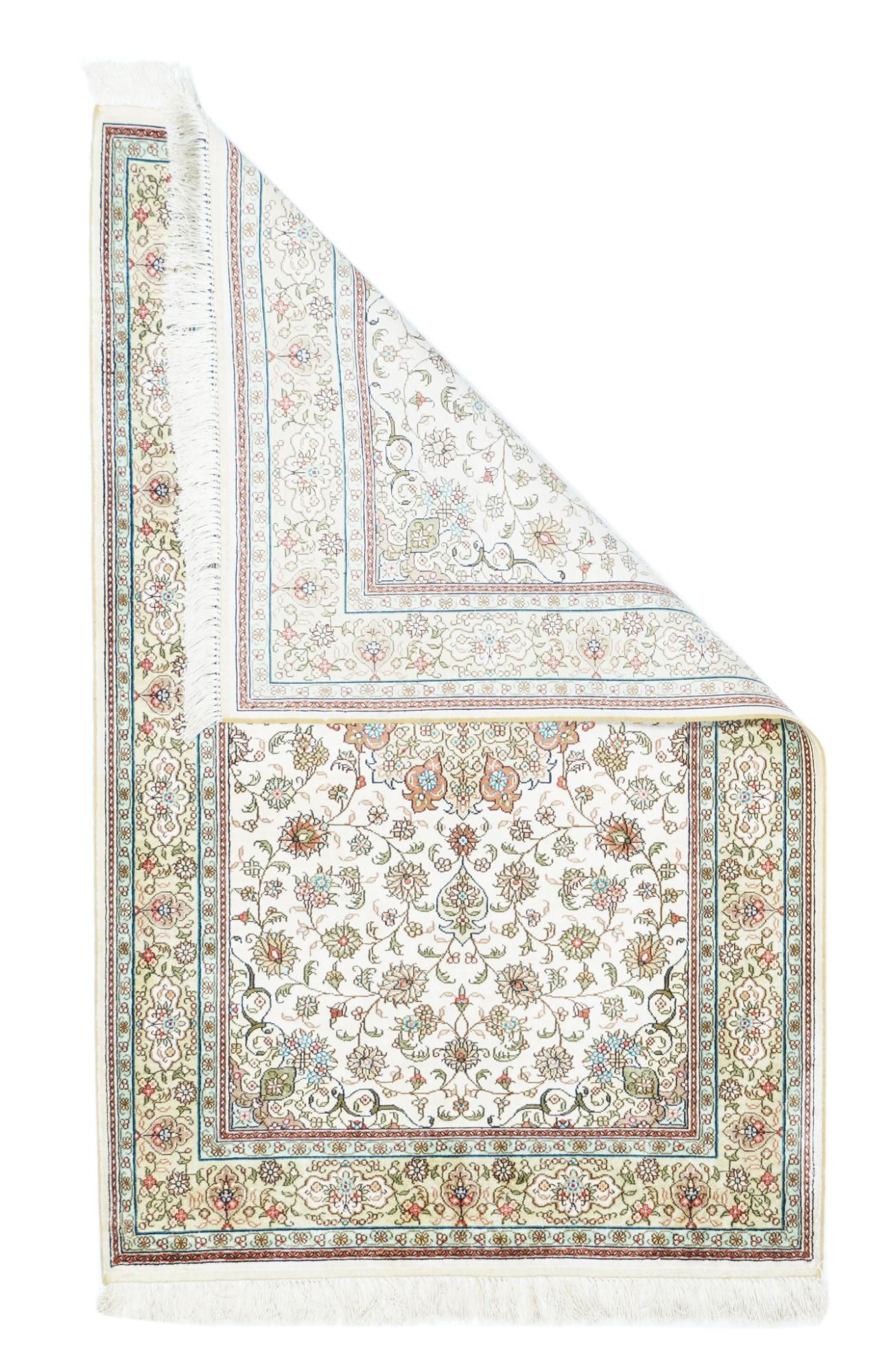 Persian Design Silk Rug 2'8'' x 4'2''. In the Persian Isfahan style, with eight plus eight straw and rose-rust round medallion, within an arabesque vinery accented with palmettes, and single and triple rosettes. Pale straw border with ecru