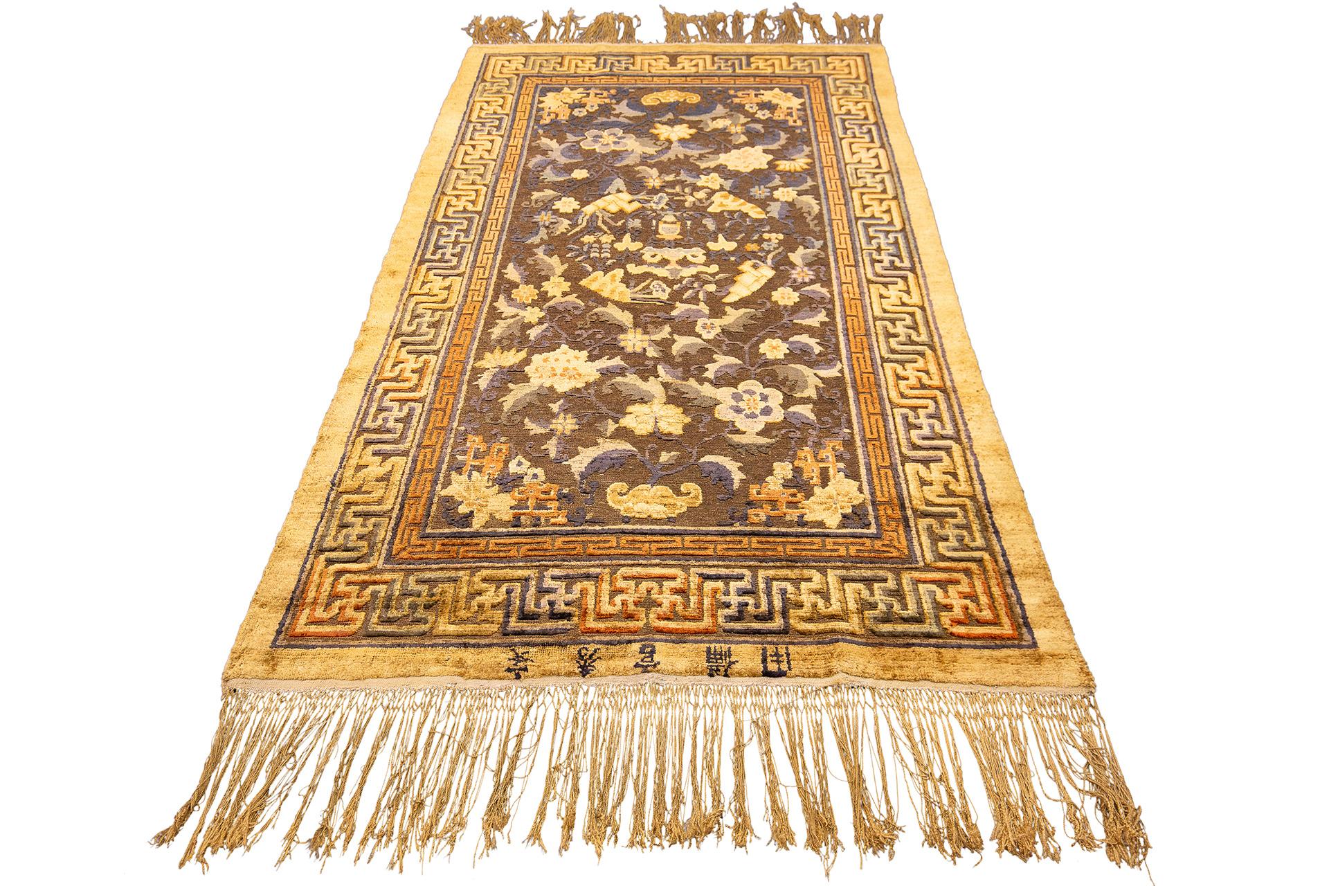 This Imperial Antique Silk & Metal Chinese rug, measuring 201 x 120 cm, is a breathtaking piece of opulence and exquisite craftsmanship, designed to captivate and enchant with its amazing details and luxurious materials. The rug’s rich history and