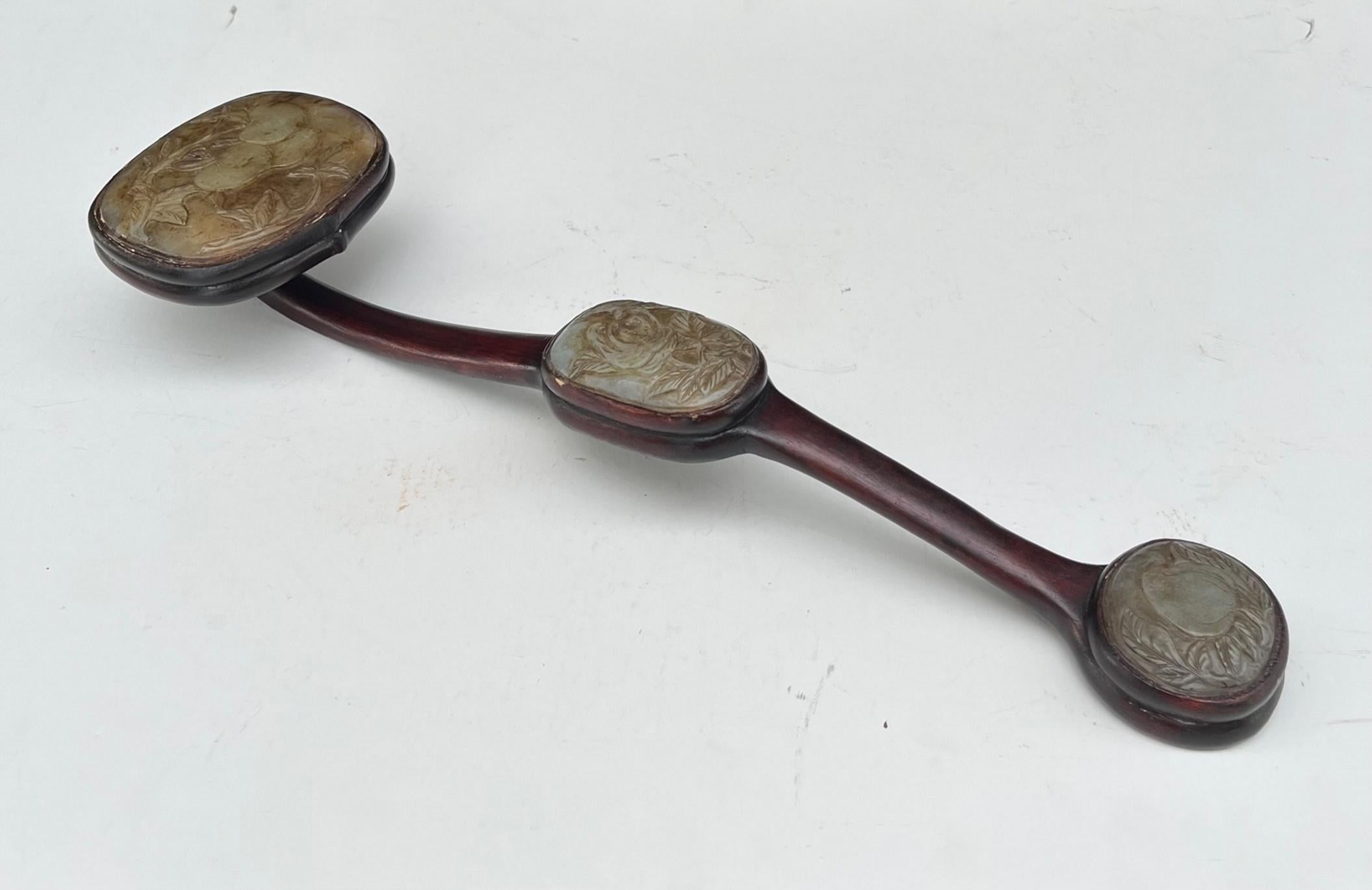 Chinese Russet Jade hardwood Imperial Ruyi Scepter Qing Dynasty 19th century, Provenance.

Large Chinese Qing Dynasty jade Ruyi scepter with three beautiful relief carved domed russet jade panels in graduating size. The panels feature designs of