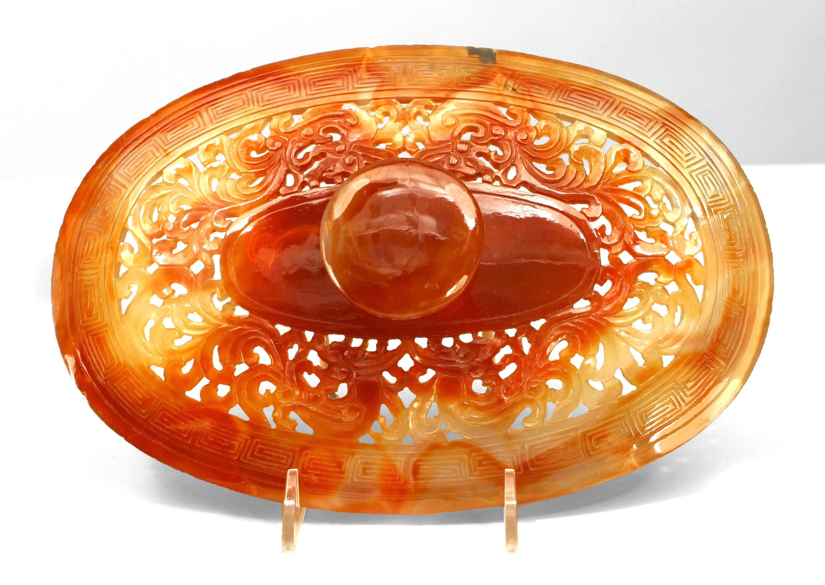 Asian Chinese rust agate oval bowl with a carved relief base supporting a pieced and carved lid with a finial top. (modern base 1¬æ