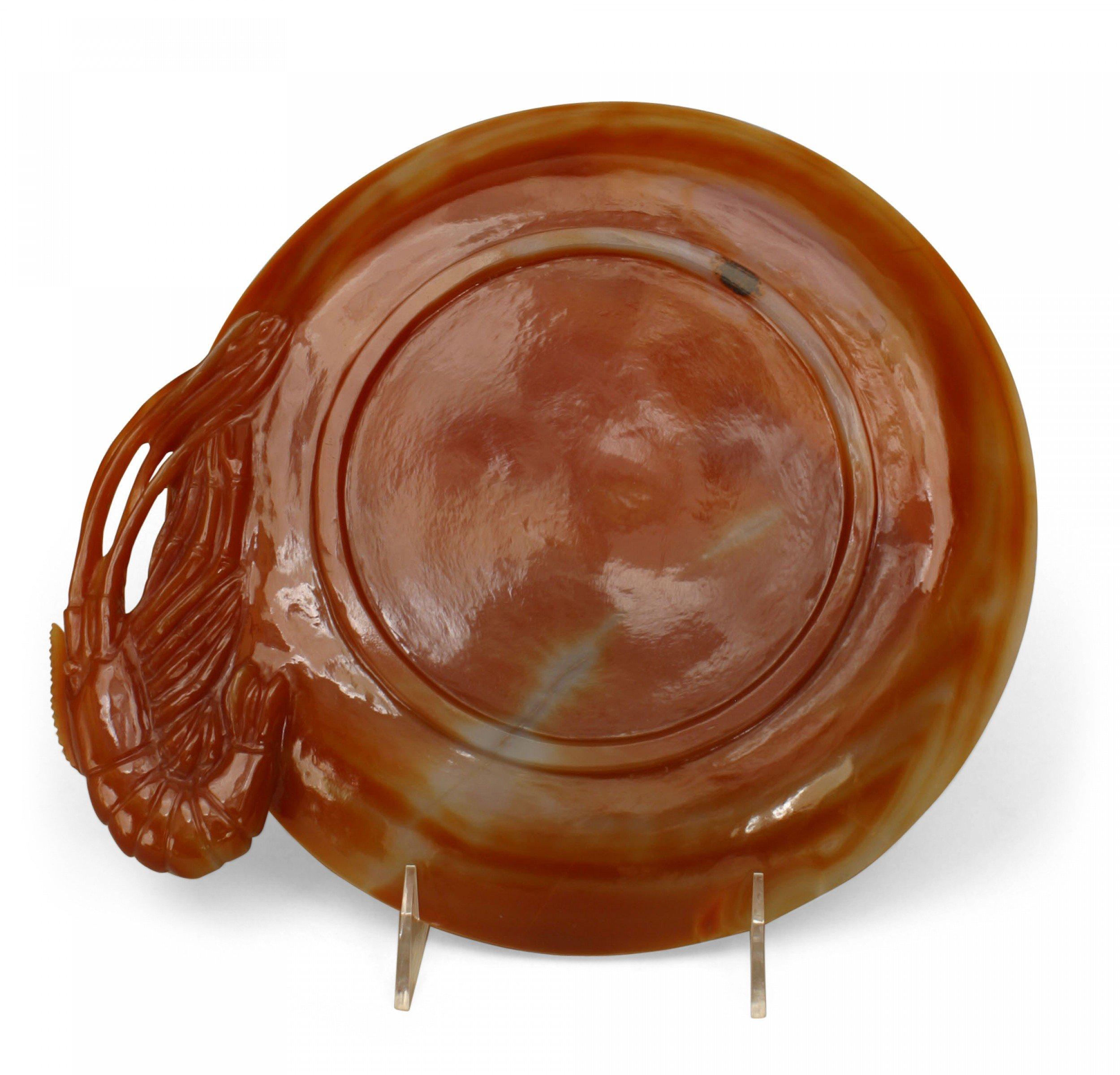 Asian Chinese rust agate plate with a carved crayfish and shells in relief and a crayfish carved handle.
 