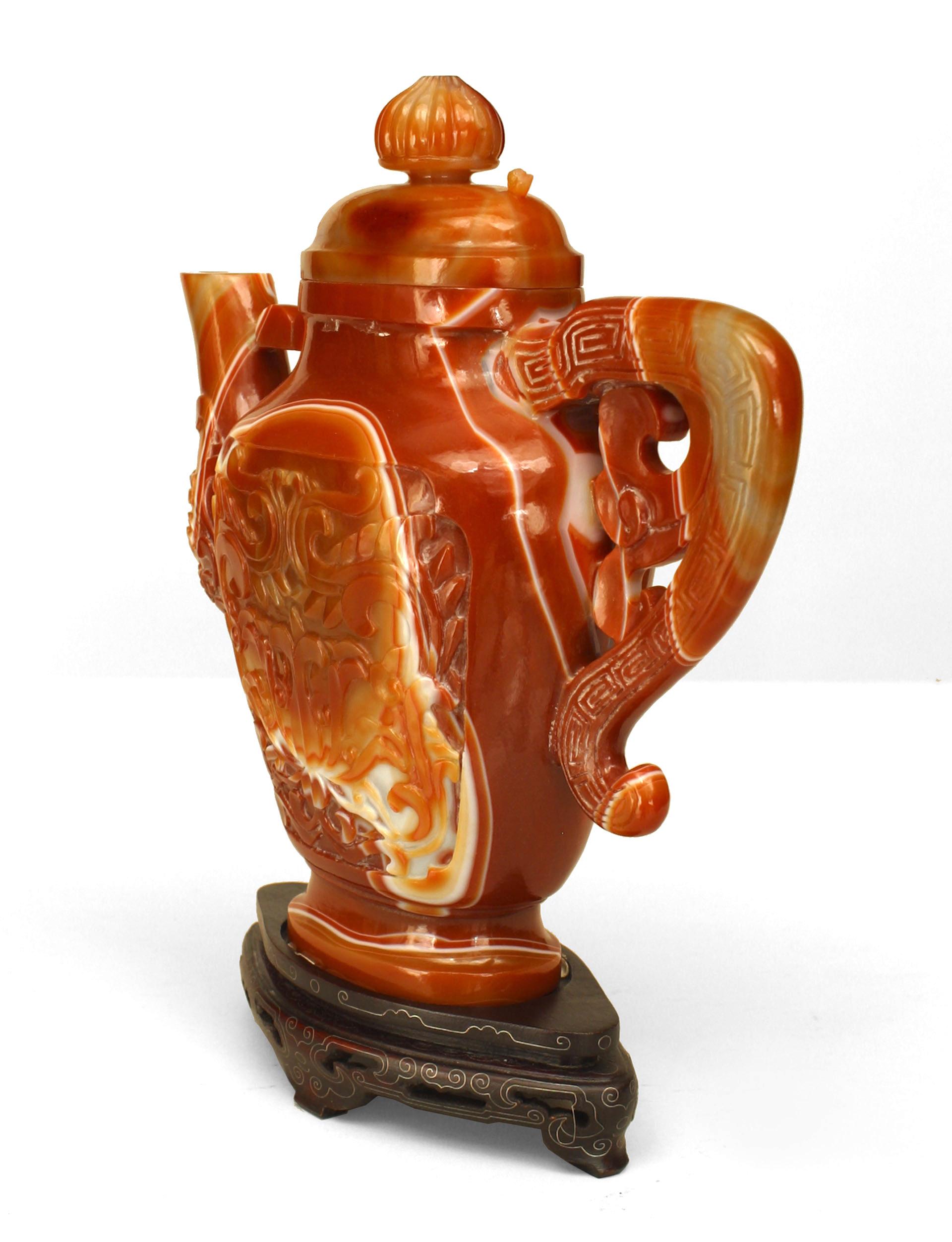 Asian Chinese rust agate tea pot with filigree handle and carved relief with a floral and scroll design. Damages to ring top-all pieces accounted.(modern base 1¬O