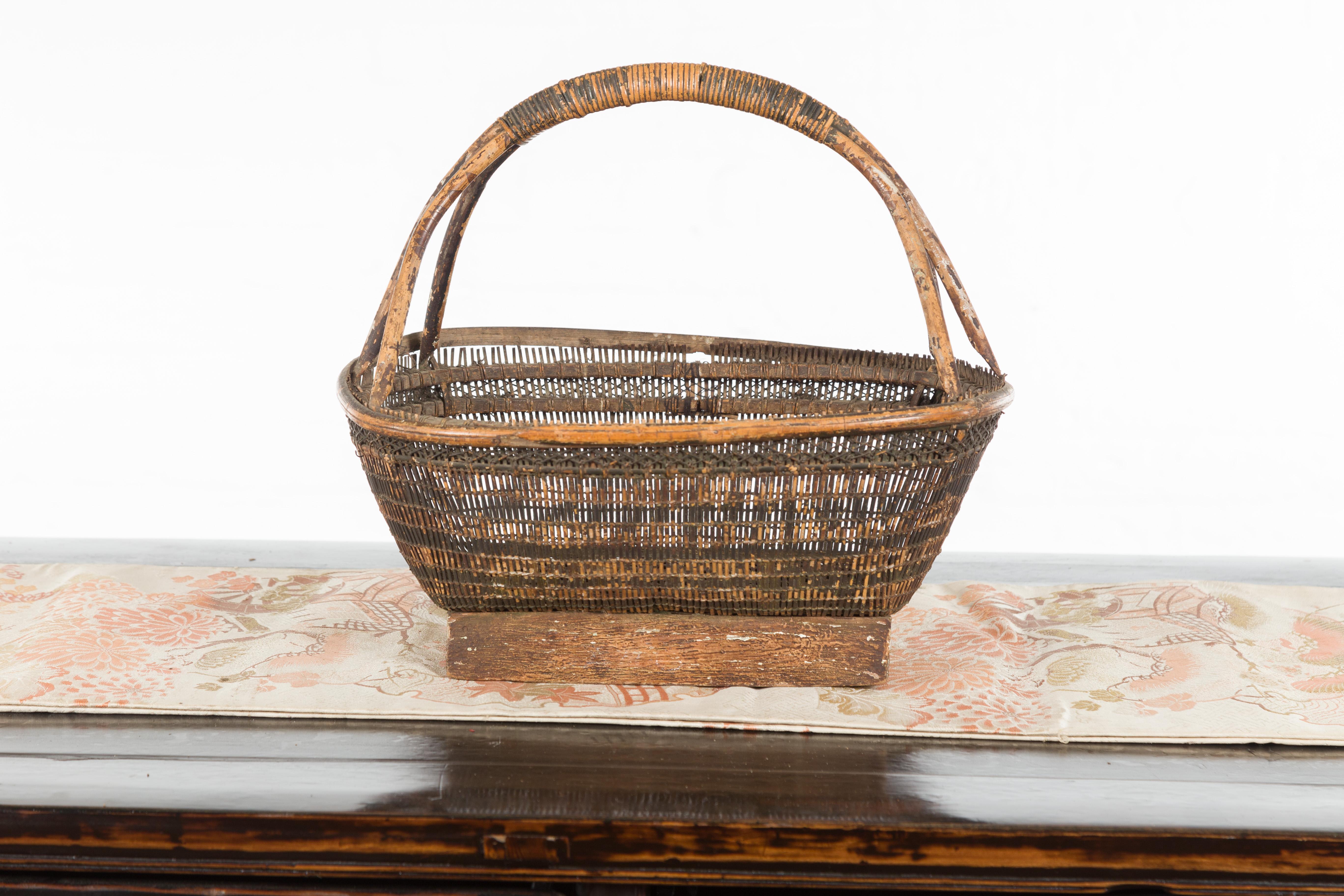 20th Century Chinese Rustic Vintage Woven Rattan Market Basket with Large Handle and Base