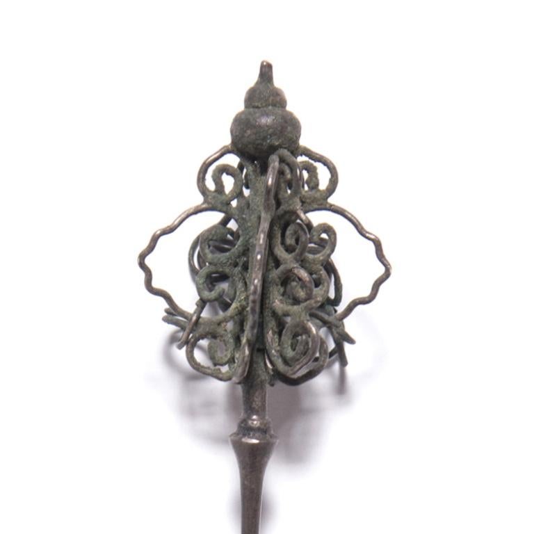 Although eyes were certainly drawn to the high, fan-shaped headdresses that Qing-dynasty women affixed to back of their heads, it was the finishing touch of a hairpin or two that completed the look. This silver hairpin ends in a cluster of spirals