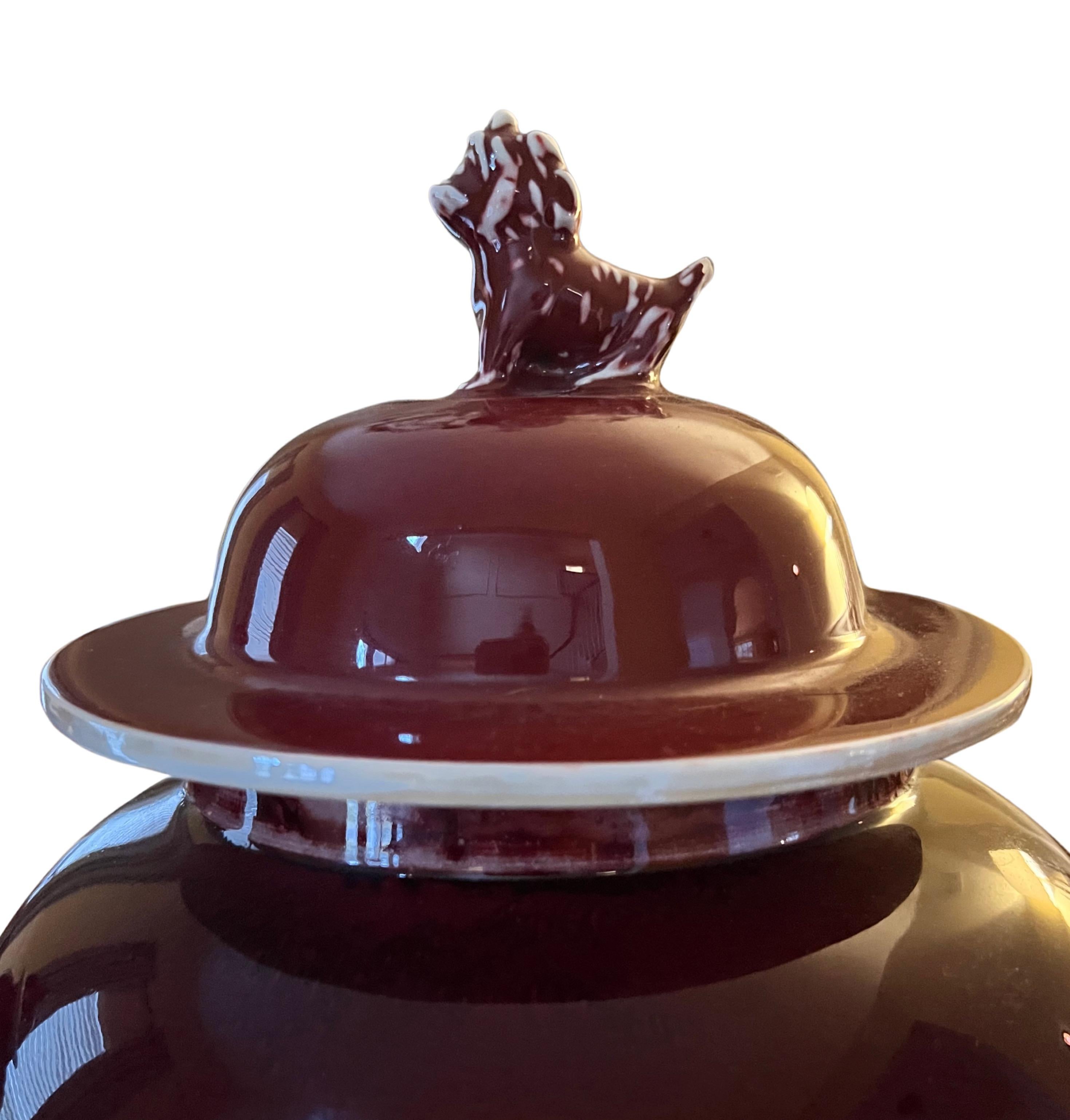 Glazed Chinese Sang De Boeuf Ginger Jars with Foo Dog Topper and Rosewood Stand, a Pair