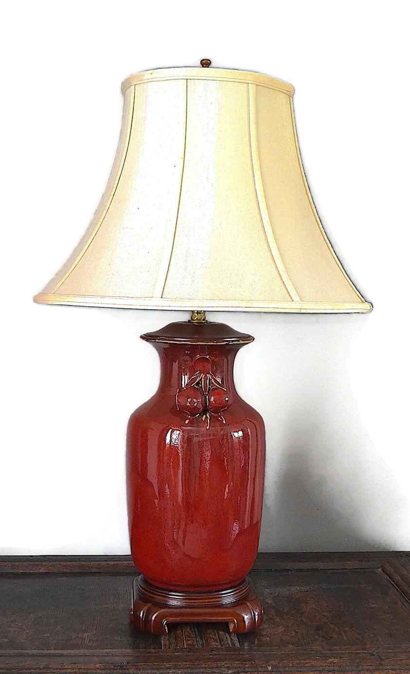 A pair of Chinese sang-de-boeuf table lamps brought back to the UK when Hong Kong was returned to China in 1997. Available with or without original shades. Re-wired for UK 230v supply with 13Amp plug.