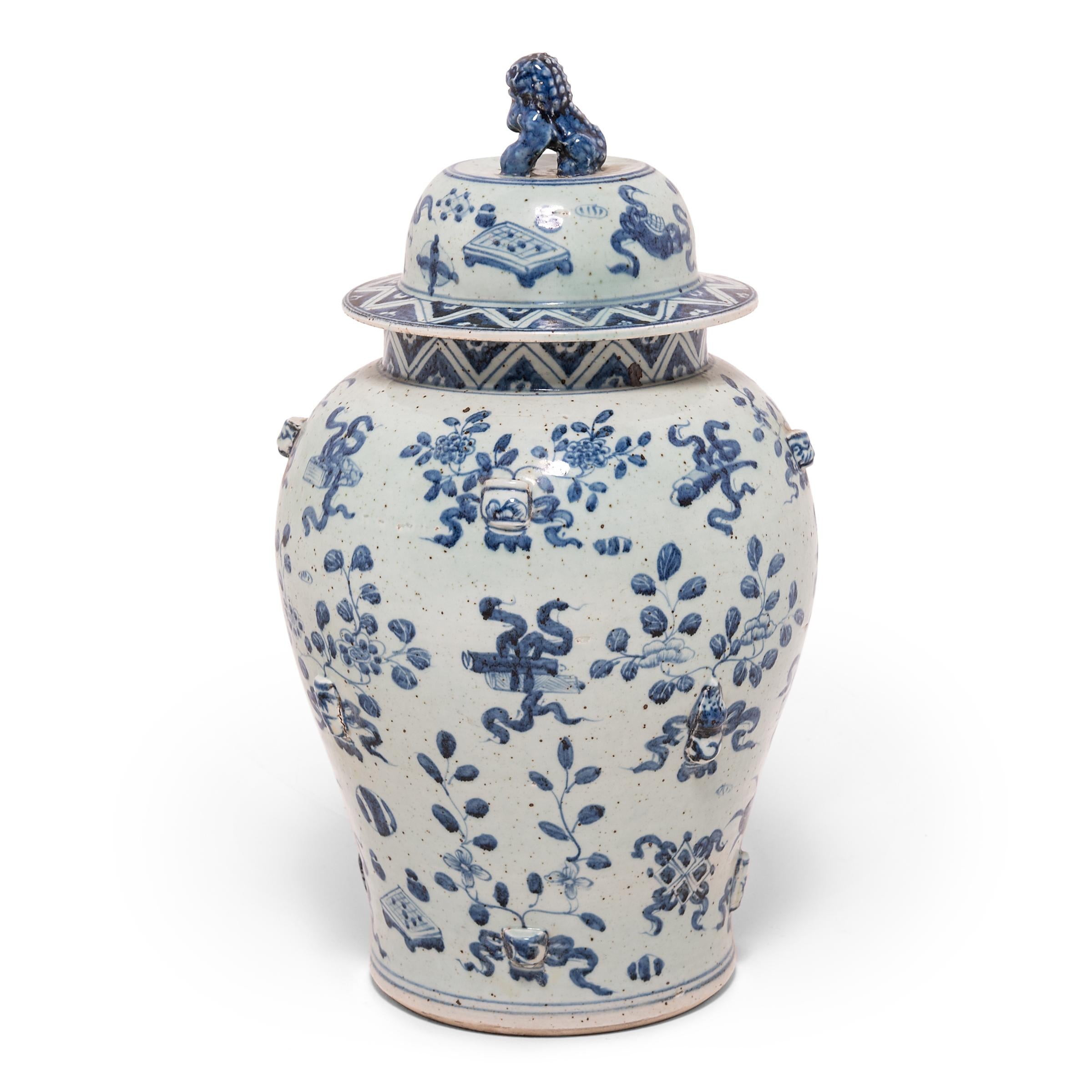 This contemporary ginger jar continues the tradition of Chinese blue-and-white ceramics with Classic curves and auspicious, hand-painted decorations. Symbols that would surely give a Chinese scholar joy - yin yang, double-luck coins, and painted