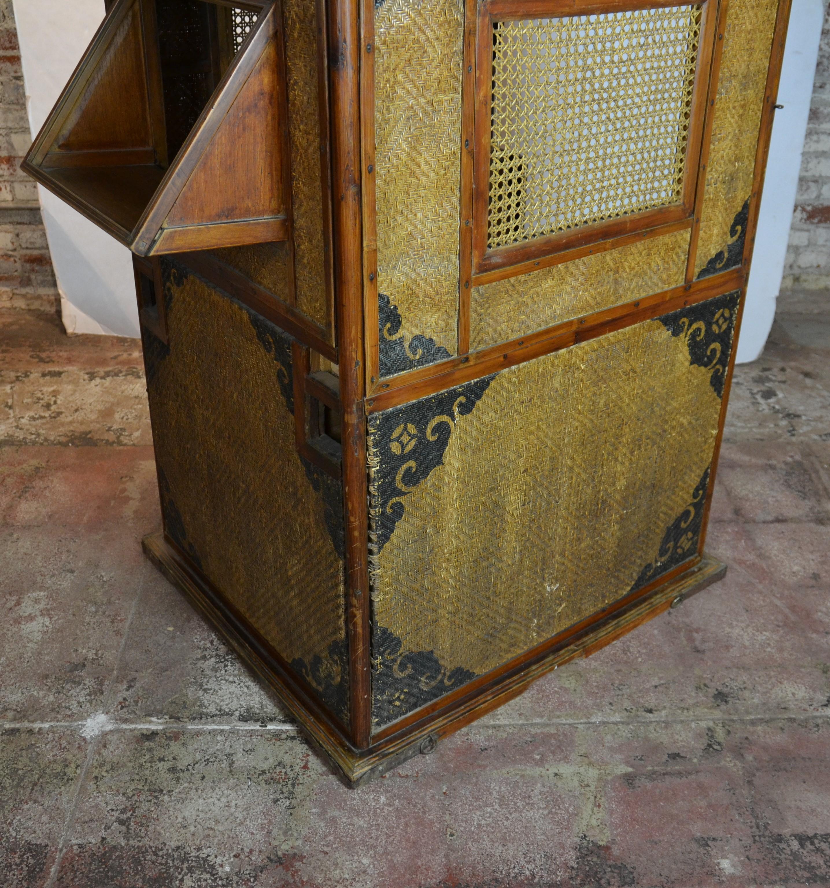 This sedan chair is made from bamboo and cane which was used by commoners. Does not come with poles.