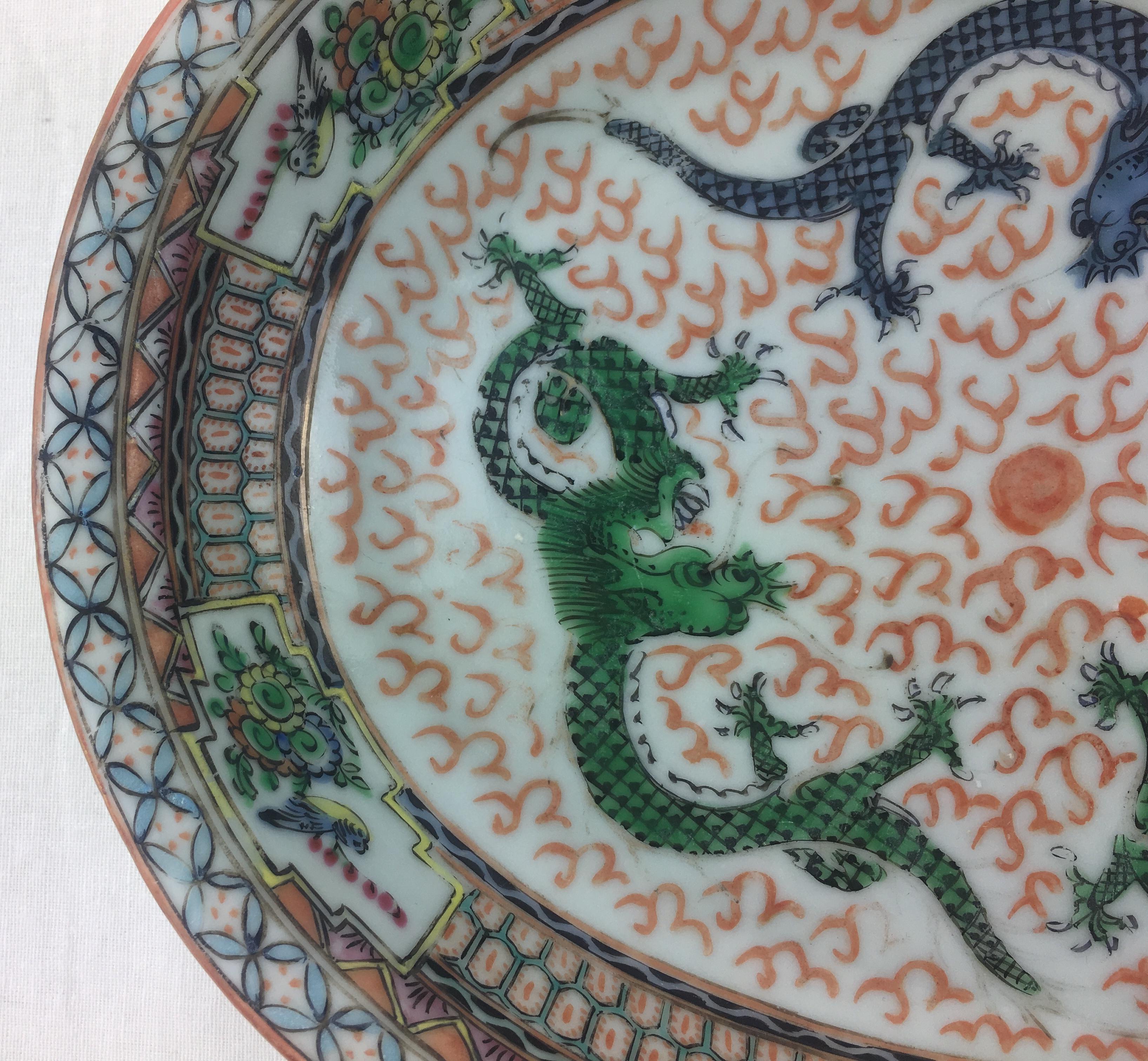 A good quality hand painted 20th century Chinese serving bowl adorned with dragons.

Dragons traditionally symbolize potent and auspicious powers, particularly control over water, rainfall, typhoons, and floods. They are also symbols of power,