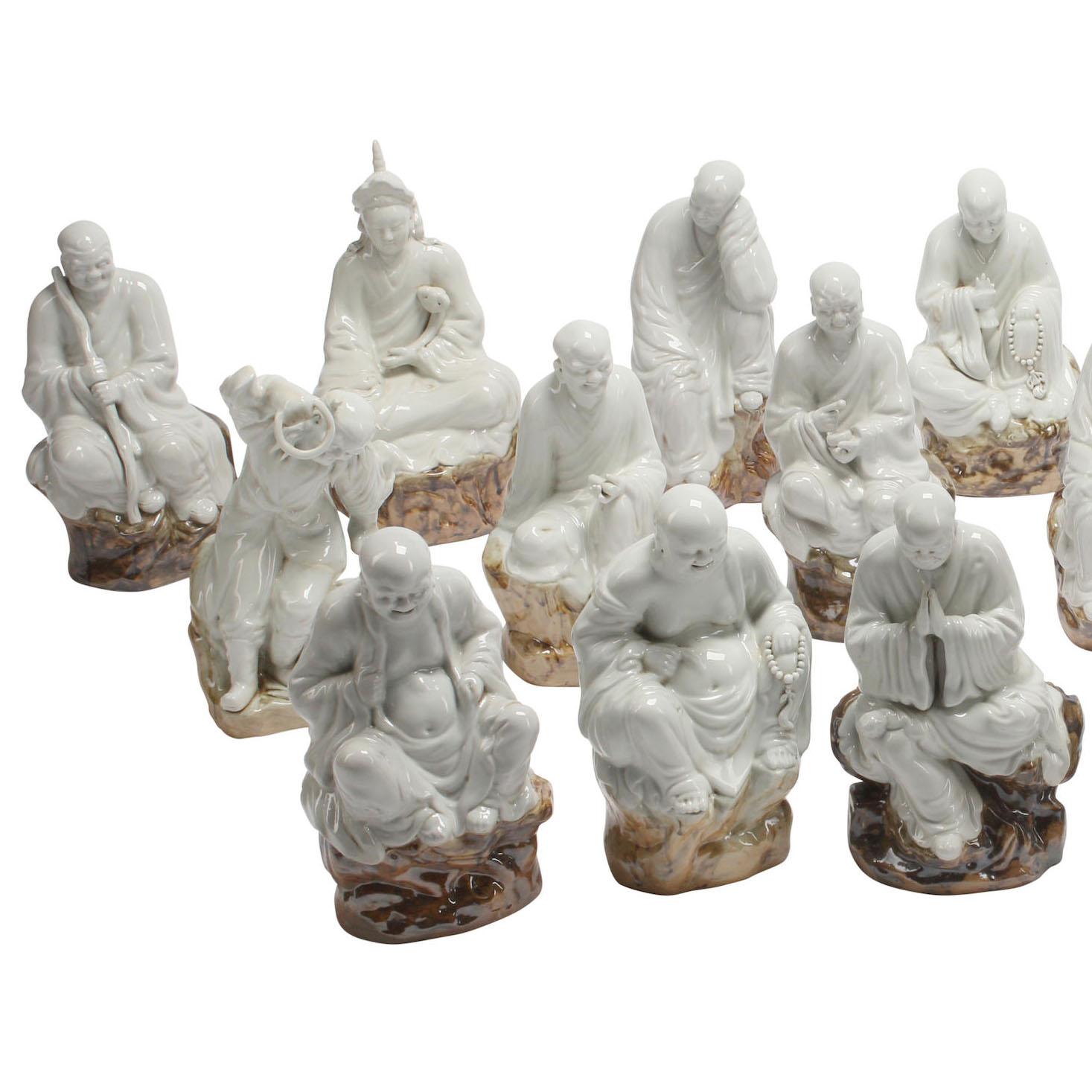 A rare set of eighteen Blanc de Chine Style Enameled - Glazed Ceramic Arhat, also known as Luohans, the disciples of Buddha, each bearing the mark and style of the Chinese maker Zeng Longsheng. The Eighteen Arhats (or Luohan) (Chinese: ????; pinyin: