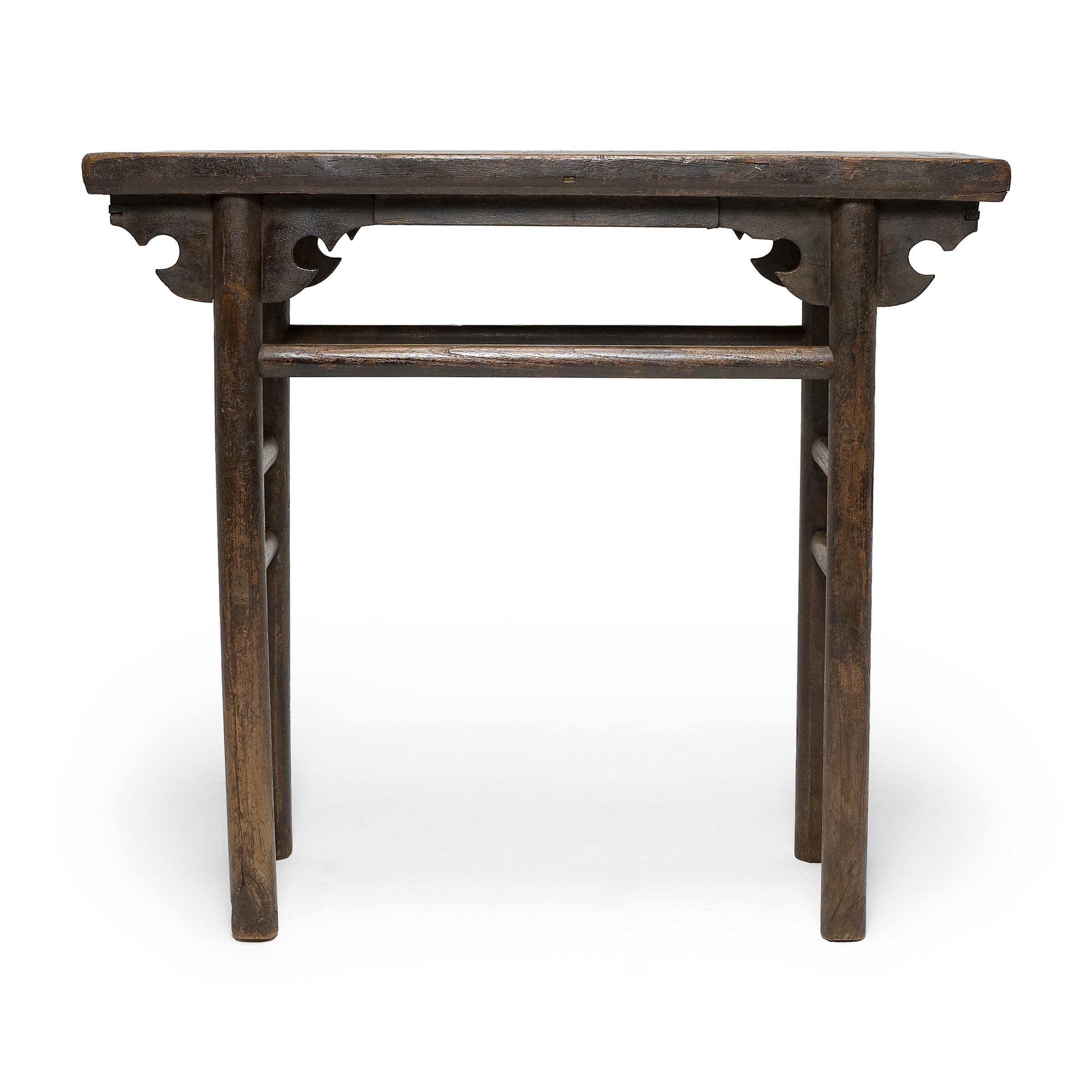 Made for sharing and offering wine and spirits, this small table once gathered together convivial imbibers who engaged in group toasts and robust consumption. Dated to the 19th century, the table is crafted of elm with mortise-and-tenon joinery and