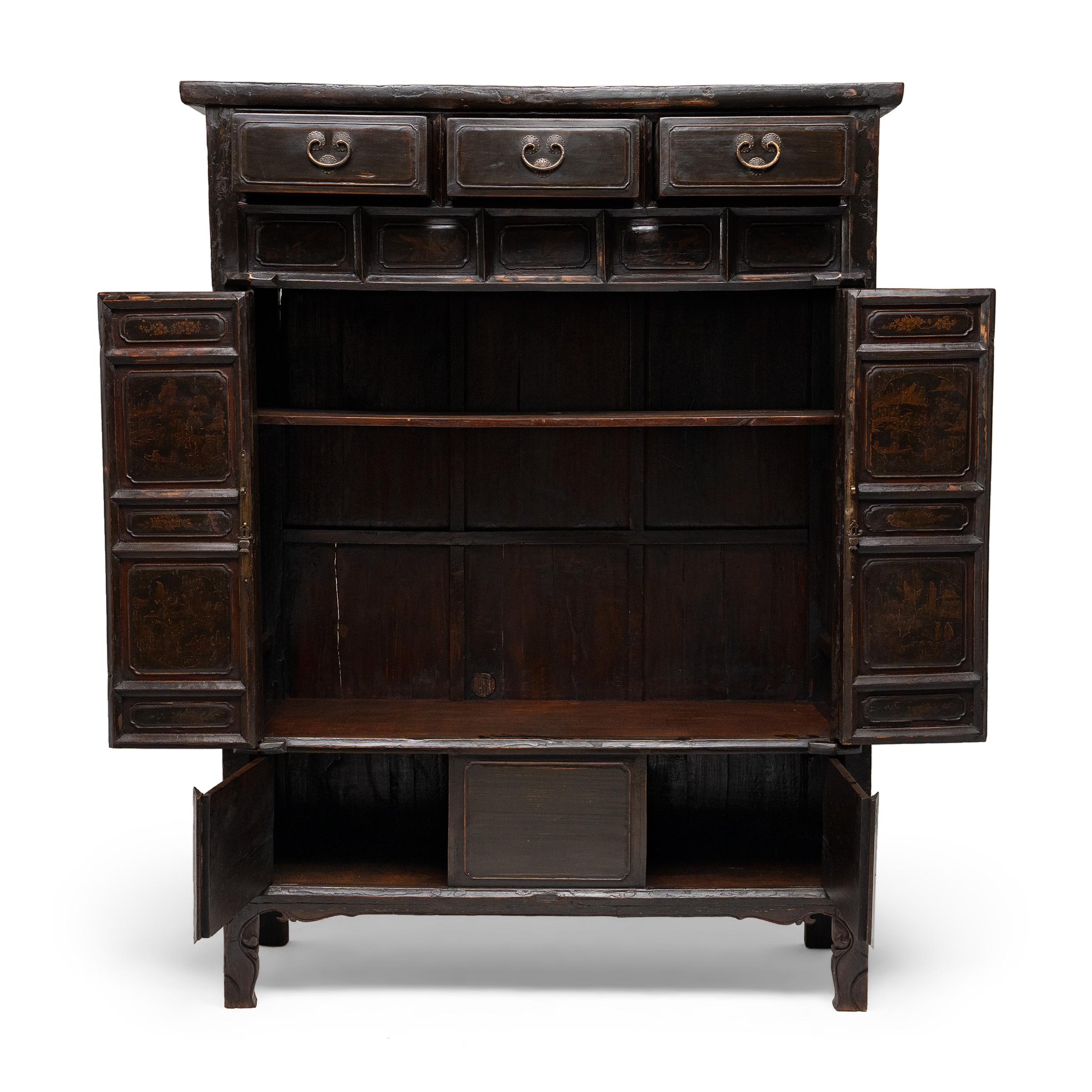 This lacquered tall cabinet was crafted in the 19th century in Shanxi province, a region known for furniture designed after old customs, often decorated with intricate carvings and highly painted finishes. In fact, this example closely resembles
