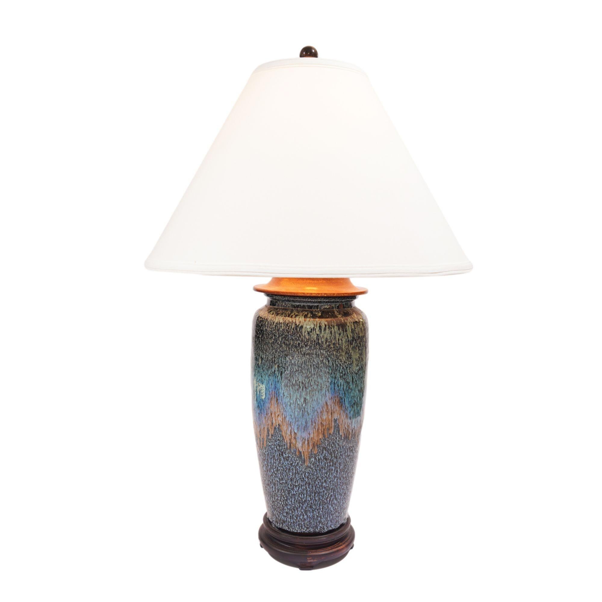 Rare Chinese flambe stoneware vase in cobalt blue, aqua, and yellow drip glazes, electrified for use as a lamp. The vase is attributed to the Shiwan kilns. Shiwan Province has been the pottery center of Southern China for centuries and is known for