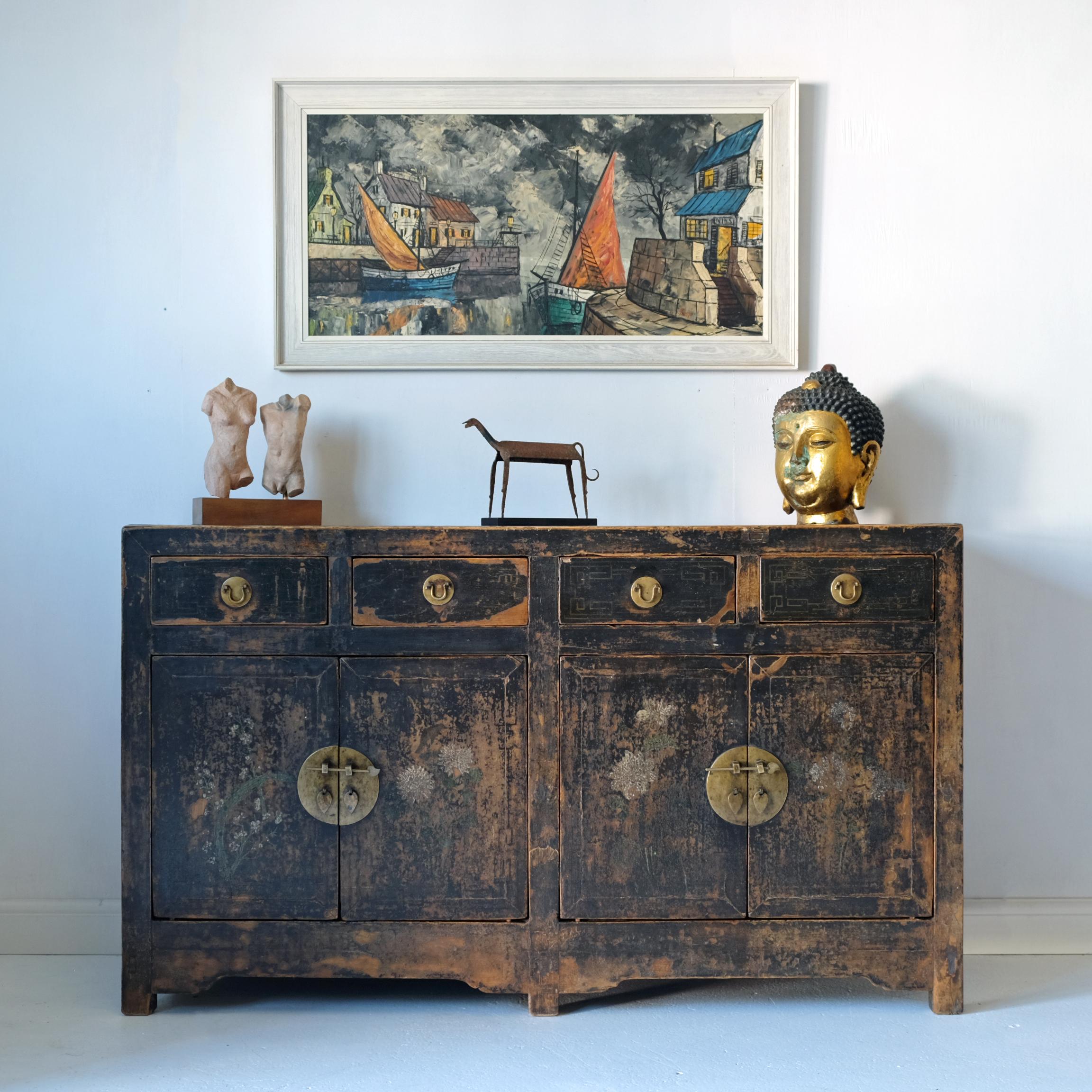 A stunning large late 19th century Chinese sideboard cabinet with original paint and lacquer. The lacquer and paint has taken on a sumptuous patina over its 100 or so year life and it’s this that gives the cabinet its unique rustic charm. The