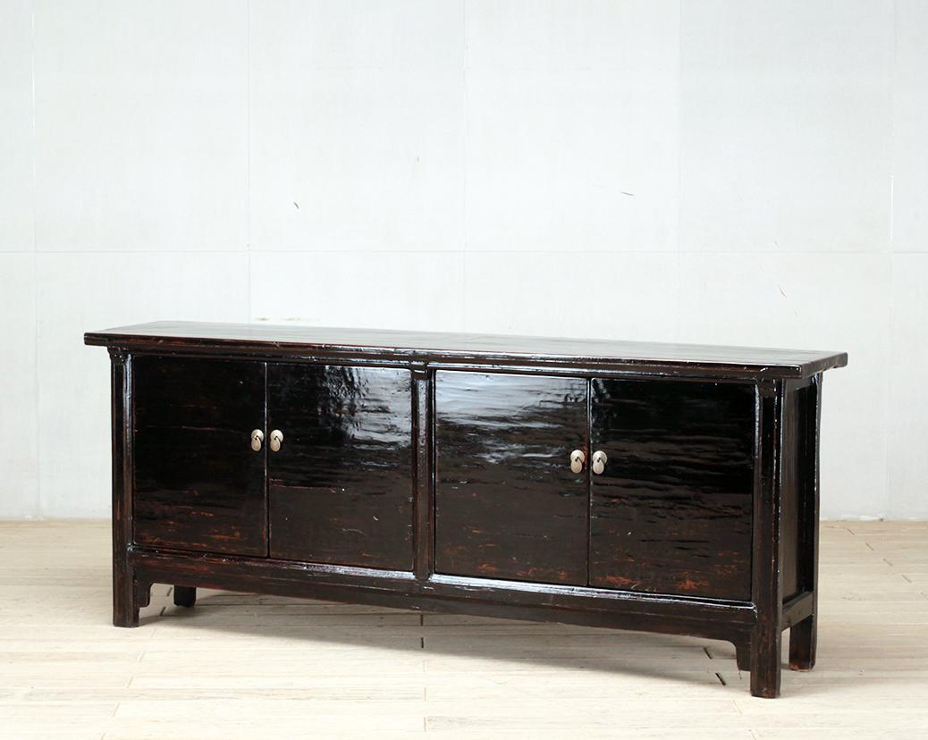 This sideboard was made from reclaimed pine wood with traditional nail-less joinery. The color on the piece has been enhanced with a sophisticated French polish finish. The piece was restored in a workshop using reclaimed wood in China and features