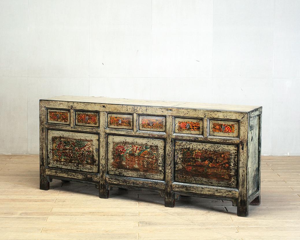 This sideboard was made from reclaimed pine wood with traditional nail-less joinery. The pine wood has been enhanced with a sophisticated French polish finish. The piece was restored in a workshop using reclaimed wood in China and features six