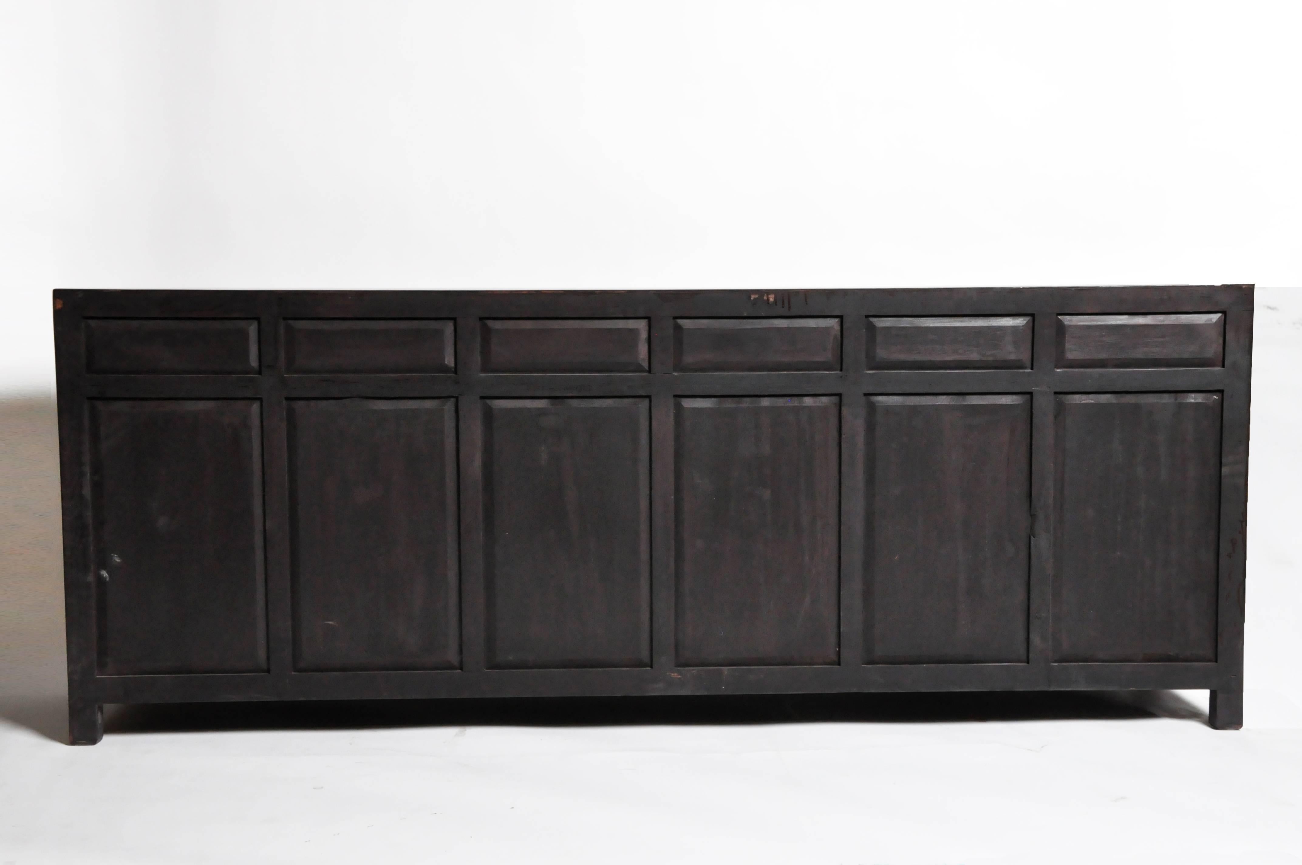 This sideboard is from Hebei, China and was made from reclaimed elm wood. The piece features mortise and tenon joinery, six drawers and three shelves below for ample storage. You can also customize it and make your own. Wood, color, finish, and