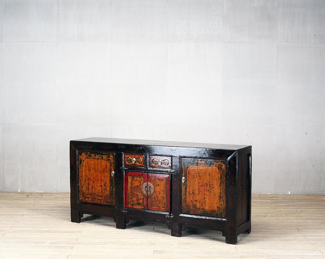 This sideboard was made from reclaimed pine wood with traditional nail-less joinery. The pine wood has been enhanced with a sophisticated French polish finish. The piece was restored in a workshop using reclaimed wood in China and features two