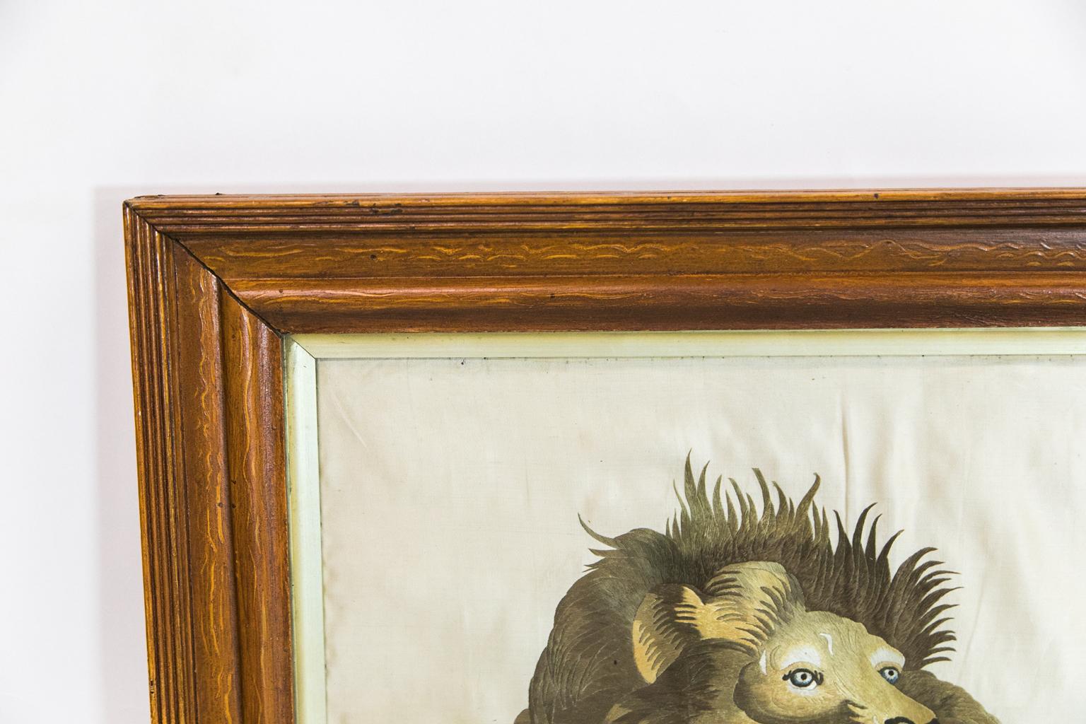 This silk lion embroidery is in a molded faux painted frame. It depicts a male and female lion walking in a tall grassland and is stitched in very intricate detail. The frame has a one-inch liner and has the original hand blown wavy glass.
 
