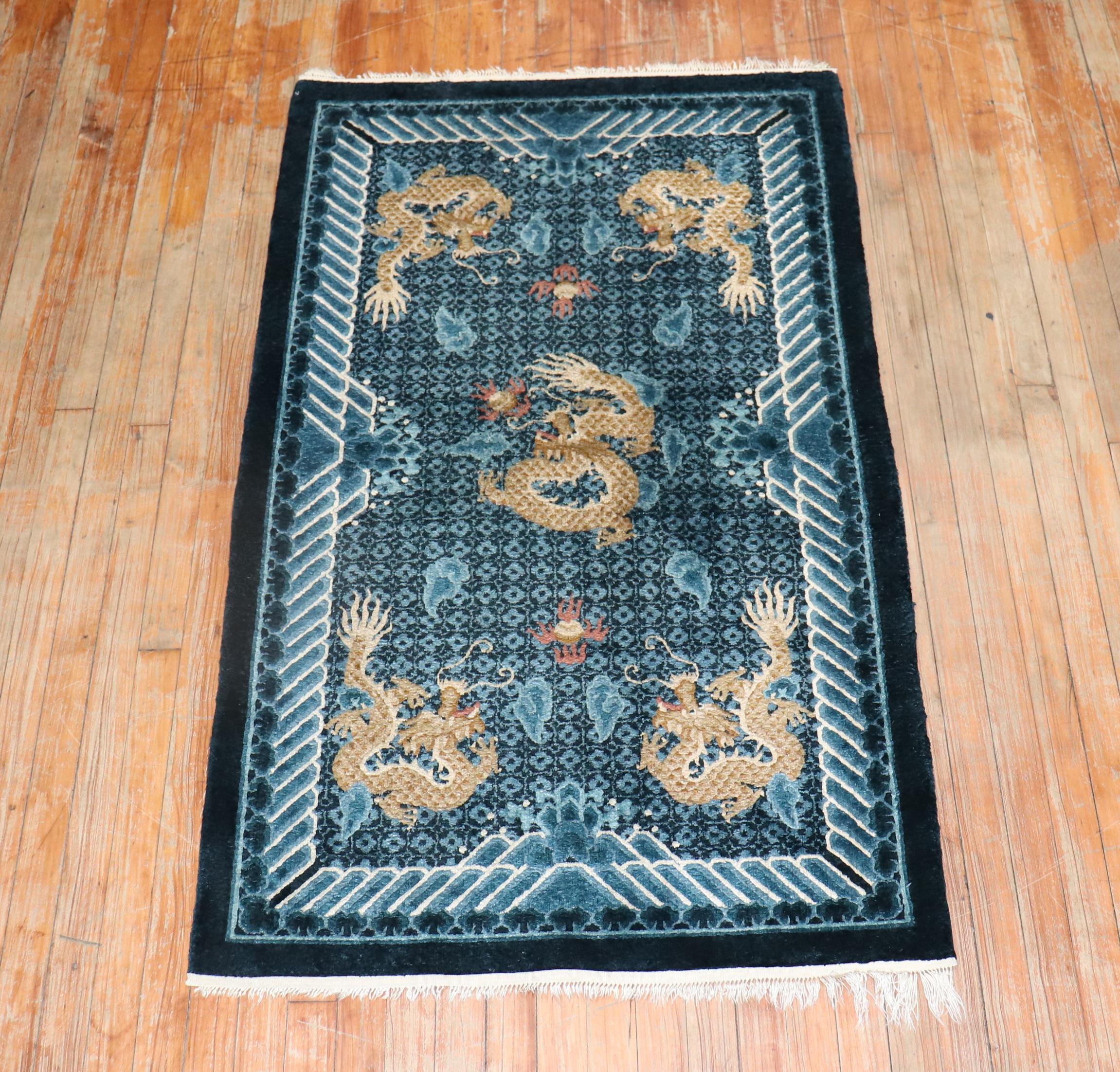 A late 20th-century  one of a kind hand-knotted Chinese Silk rug with a dragon motif 

Measures: 3' x 5'