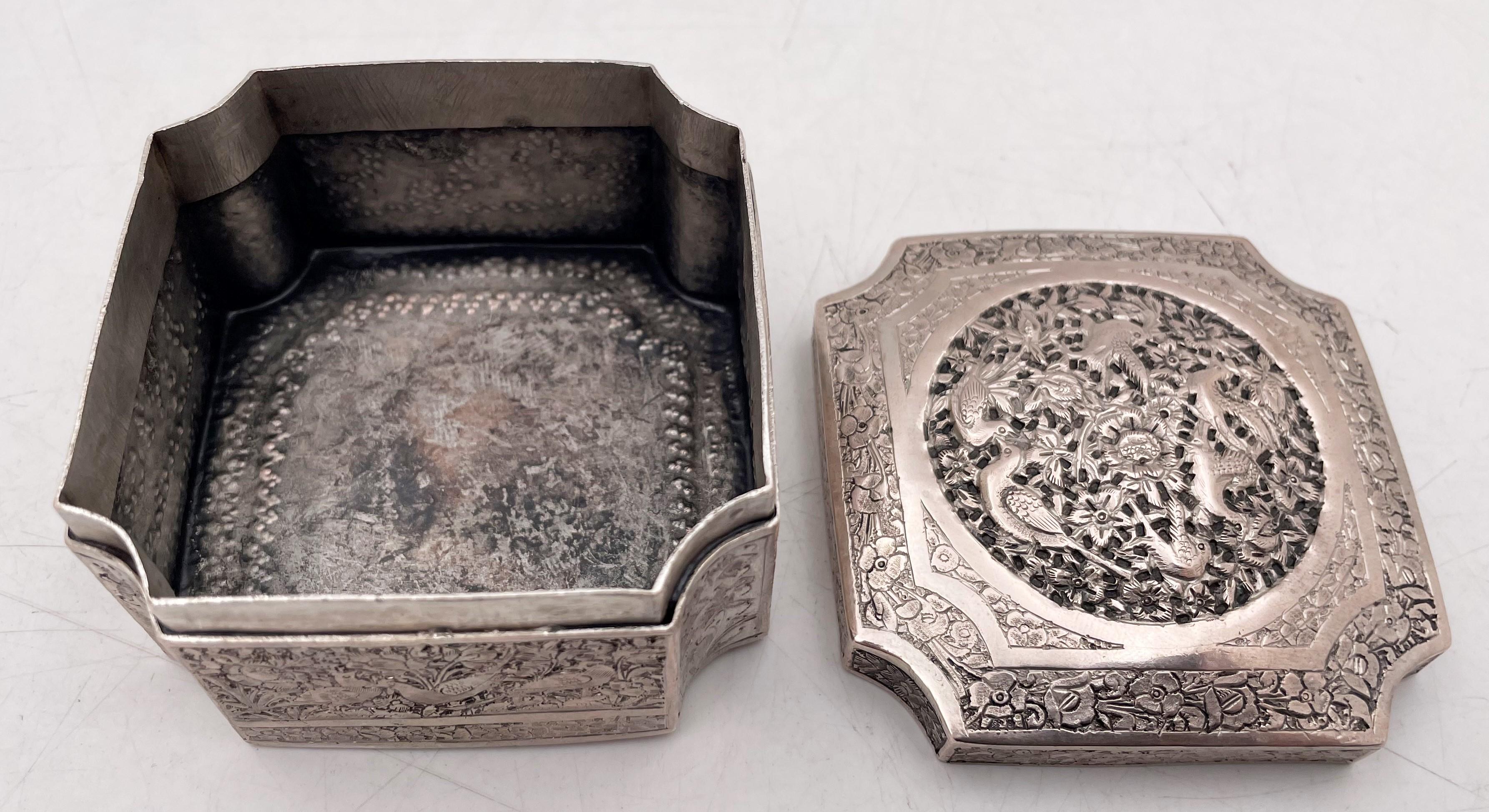 Chinese silver box, with an intricate design showcasing birds, floral, and other natural motifs, measuring 2 7/8'' by 2 7/8'' by 1 7/8'' in height. 

Please feel free to ask us any questions, and please see our other listings. We hand polish all