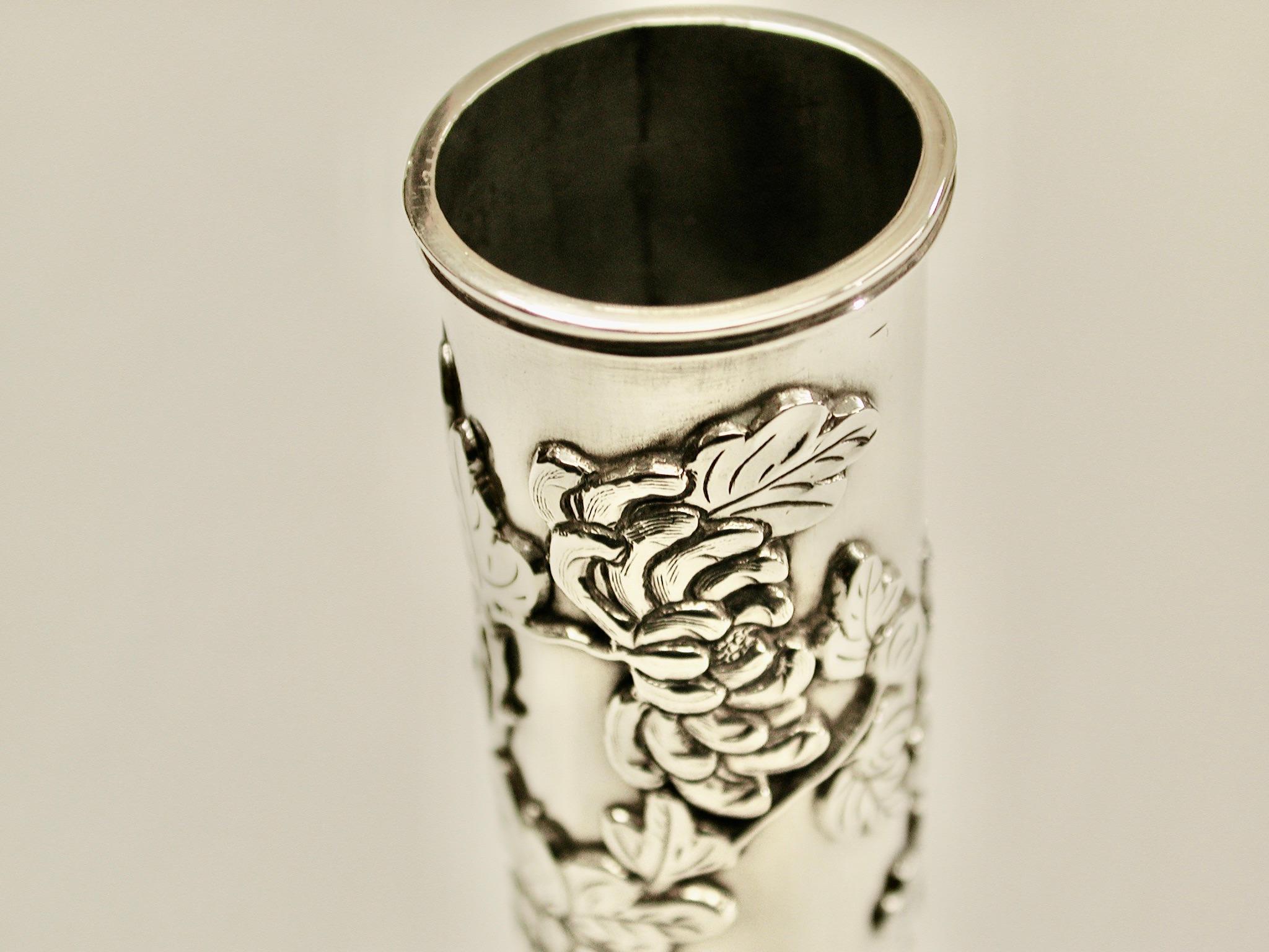 Chinese silver bud vase decorated with Chrysanthemum and bamboo feet, circa 1890
Made by Wing Chun of Hong Kong.