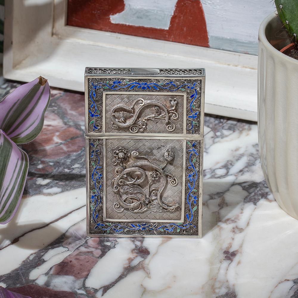 Late Qing Dynasty Circa 1910

From our Chinese collection, we are delighted to offer this Chinese Silver & Enamel Card Case. The Card Case of rectangular form cast in Silver with a pierced silver fish scale style pattern around the edge. The front