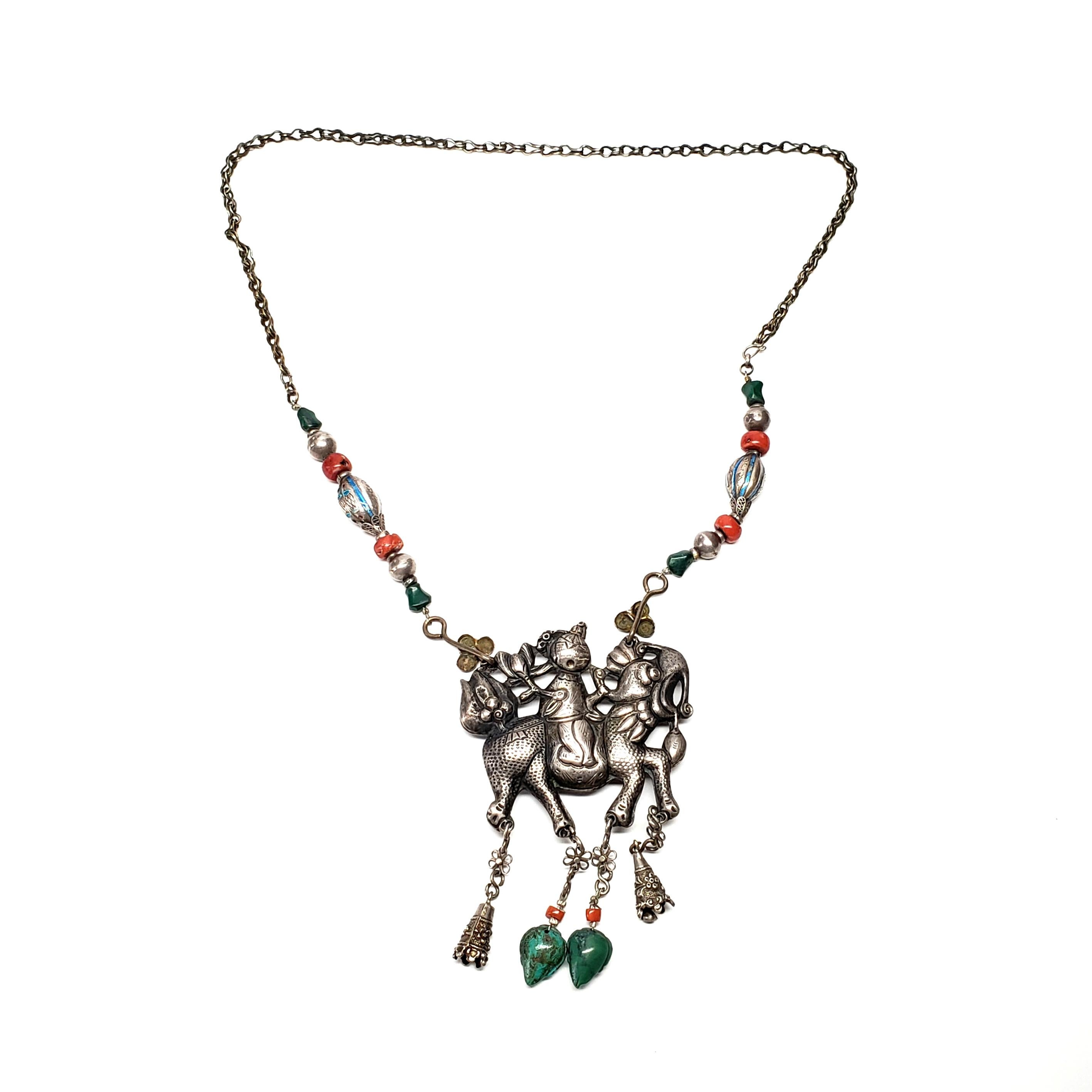Antique Chinese Qilin (Kylin) amulet and beaded necklace.

The Qilin is a Chinese mythical creature, often called a Chinese unicorn. This amulet features a rider on the Qilin for luck and good fortune. The amulet hangs from a beaded necklace