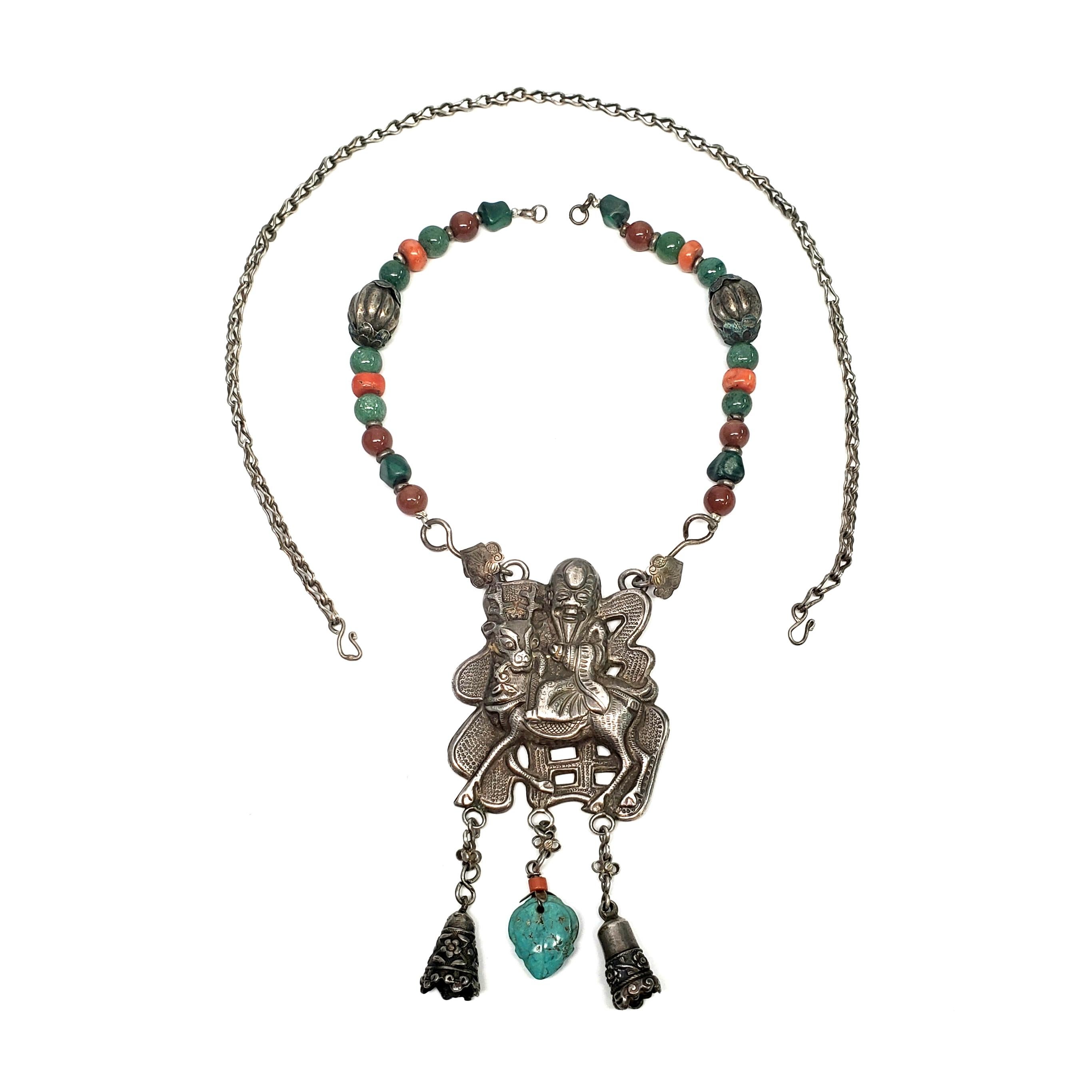 Antique Chinese Qilin - Kylin - amulet and beaded necklace.

The Qilin is a Chinese mythical creature, often called a Chinese unicorn. This amulet features a happy and prosperous rider on the Qilin for luck and good fortune. The amulet hangs from a