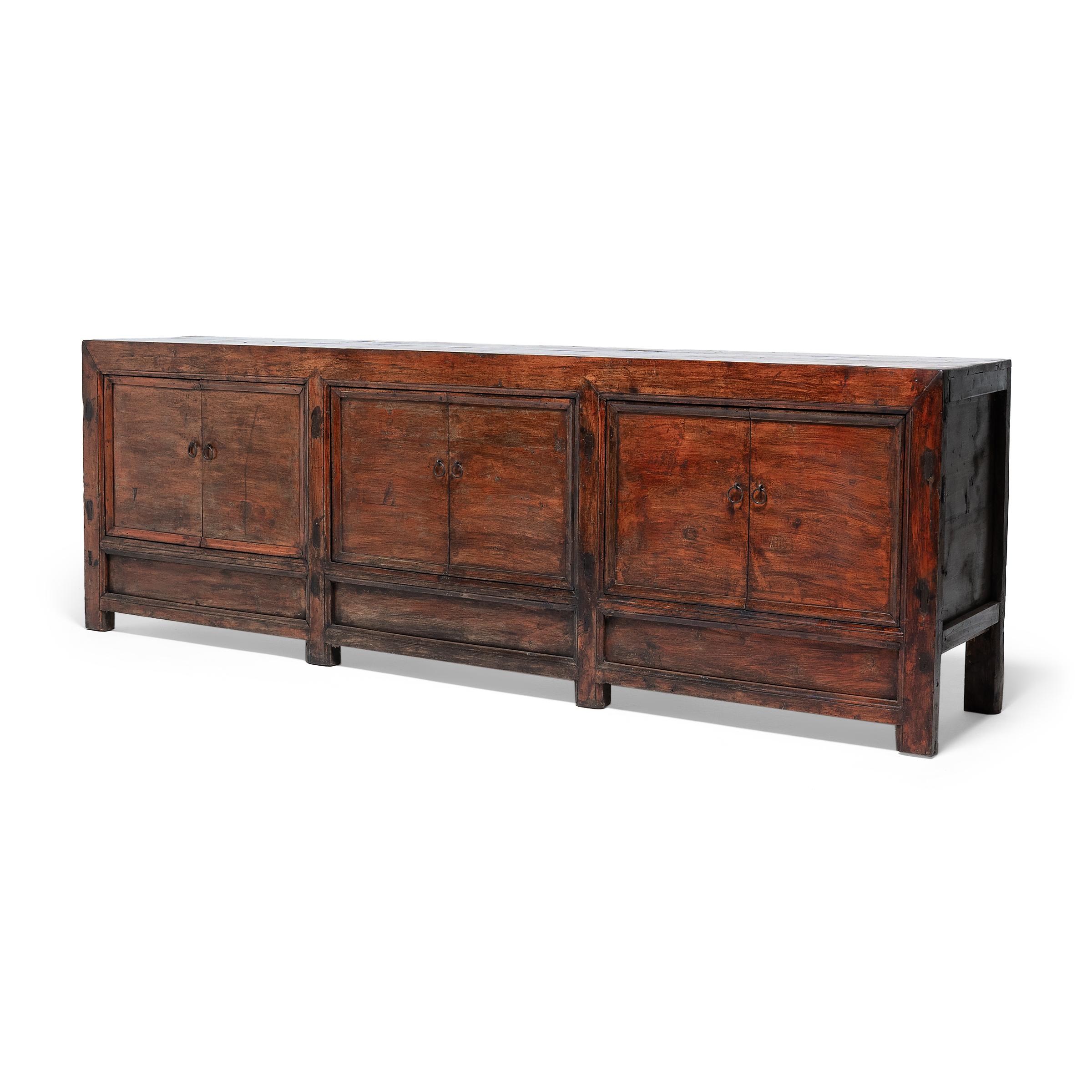 Created in the style of Mongolian storage coffers, this late 19th-century herdsman's chest has a straightforward design and plenty of rustic appeal. Originally configured to open from the top, the coffer was modified with six front-facing doors by