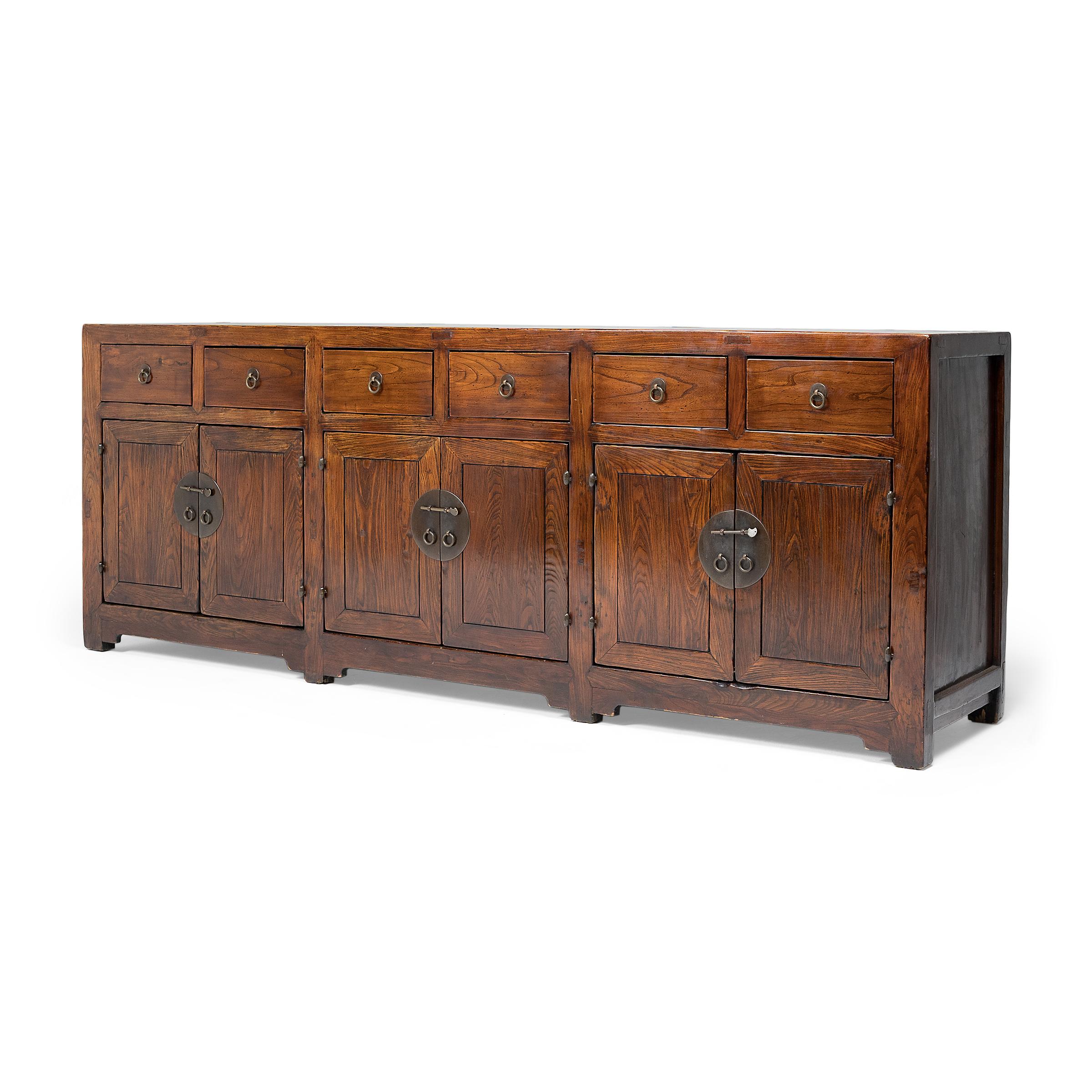 This provincial coffer from northern China has a simple, clean-lined form. The coffer dates to the early 19th century and is expertly crafted of walnut using traditional mortise-and-tenon joinery methods. The square-corner cabinet features six
