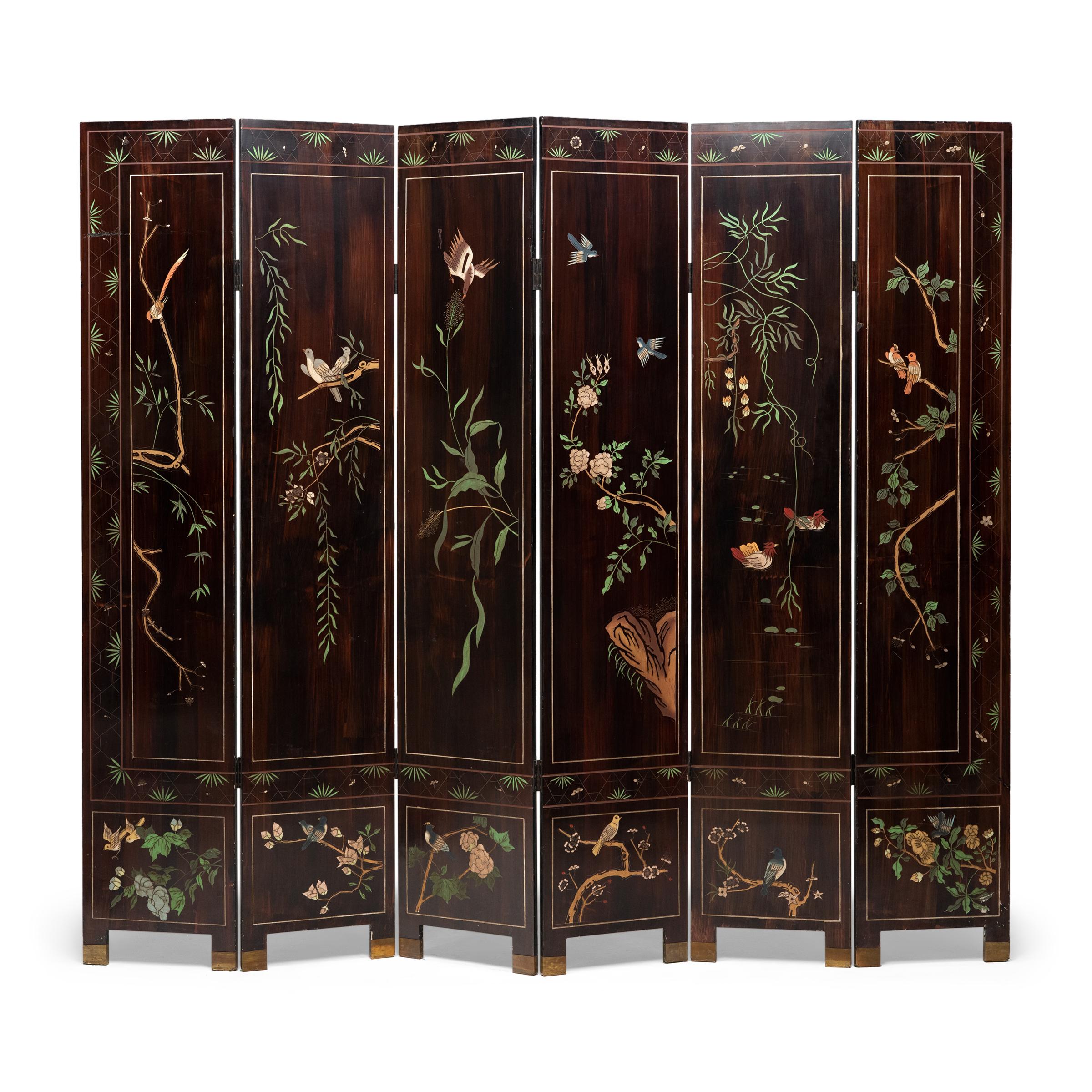 This coromandel lacquer screen is incised with colorful scenery depicting idyllic courtly life in a palace complex. Finely dressed ladies and their female attendants stroll throughout a grand enclosed courtyard of elaborate pavilions and low